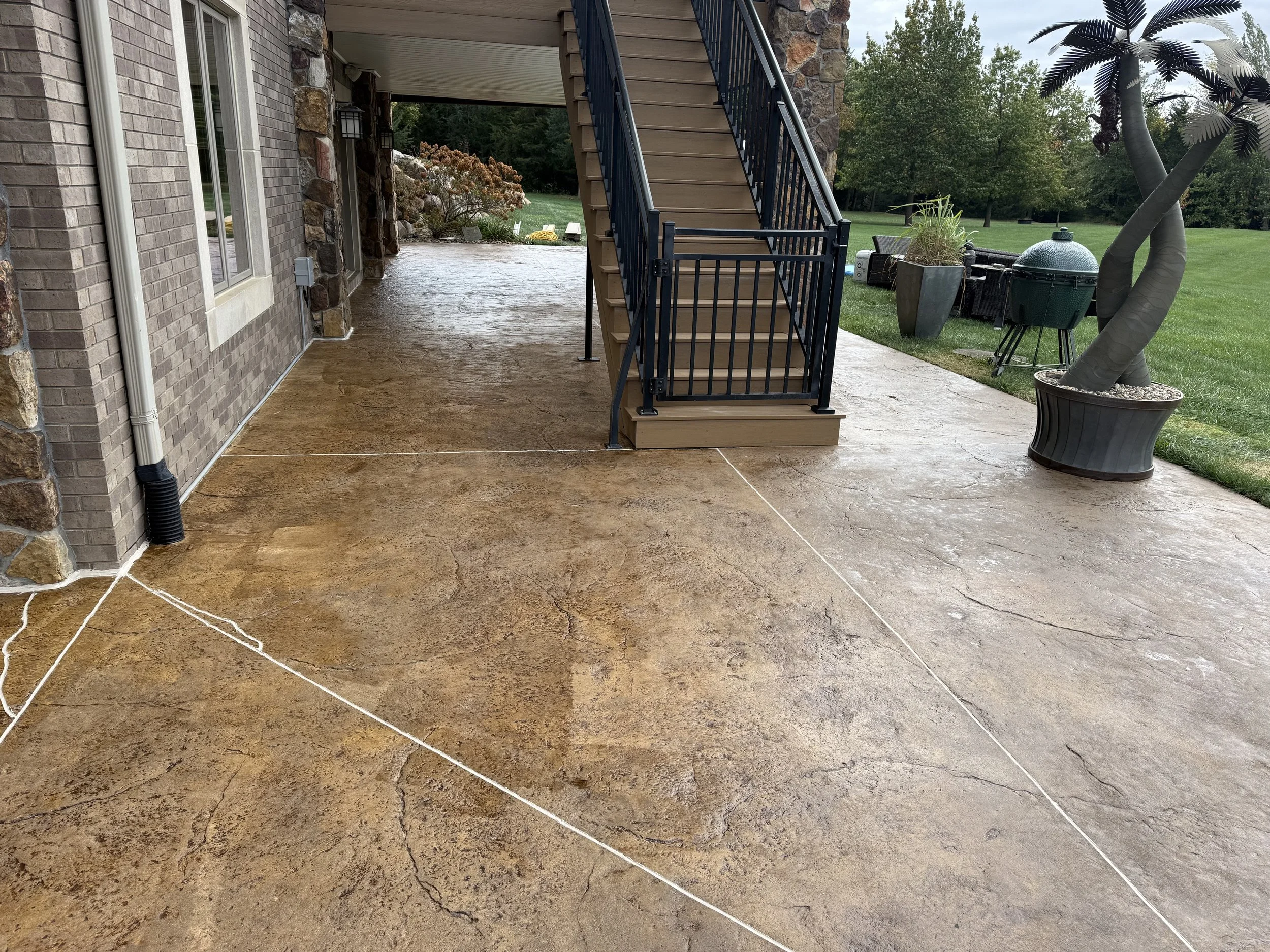 Beautifully finished stamped and colored concrete patio, providing an elegant outdoor living space in Waukee.