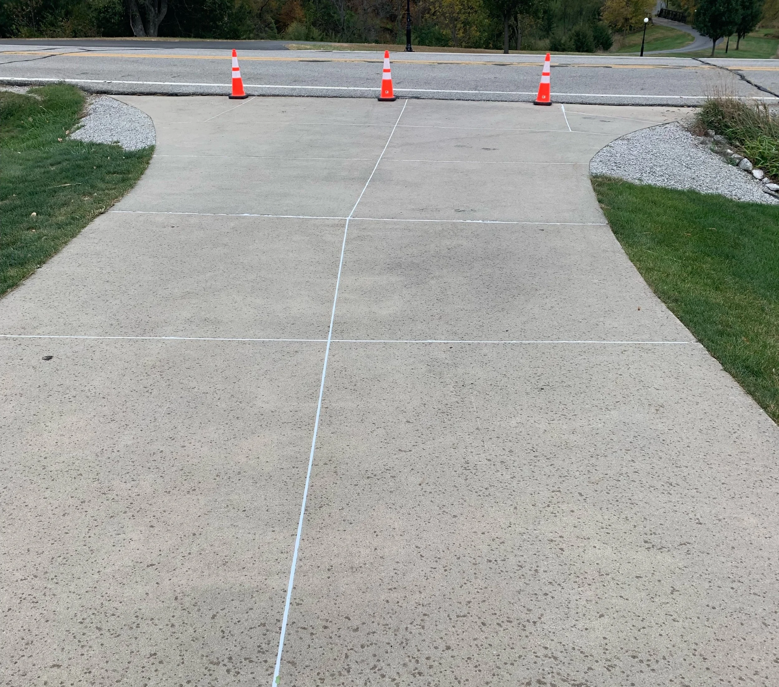 Cleanly caulked residential concrete section, sealed to keep plants out and curb appeal up.
