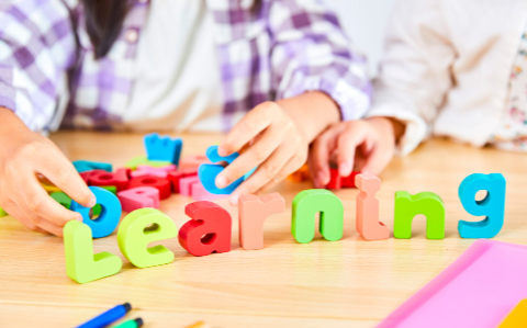 kelowna daycare colorful blocks spelling learning