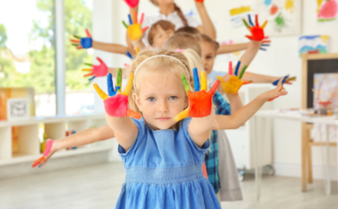 kelowna daycare preschoolers with colorful paint on their hands