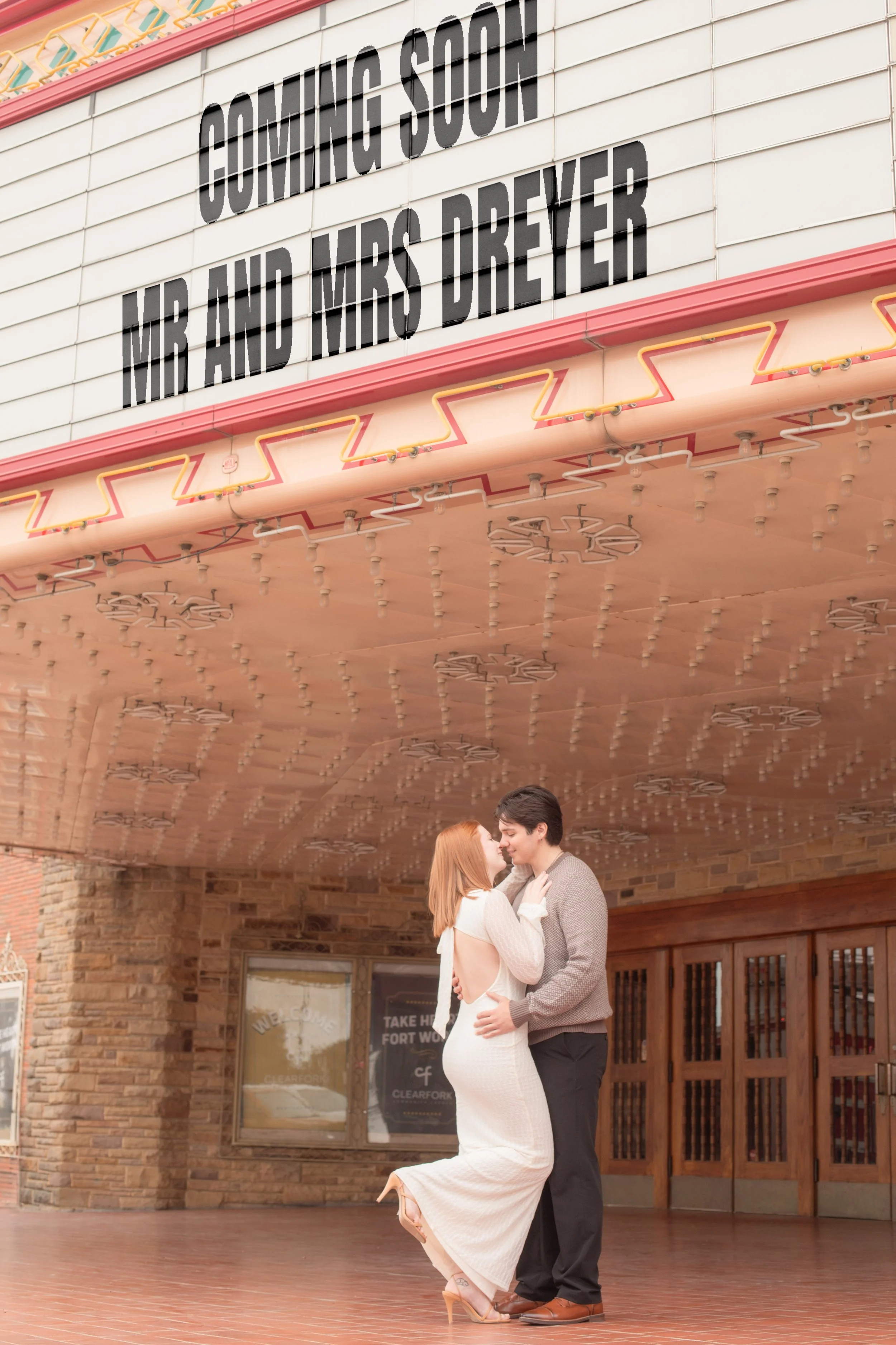 A couple dancing in front of a historic theater marquee with an upcoming show featuring Mr. and Mrs. Dreyer.