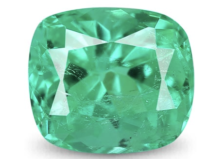 A large, faceted emerald gemstone with a cushion cut and a vibrant green color.