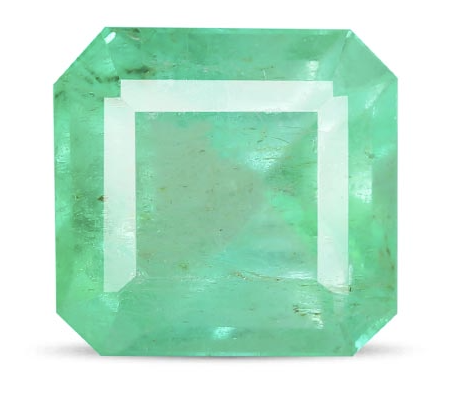 Green gemstone with an octagonal shape and carved stepped design.