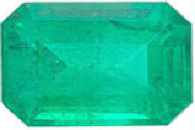 Emerald green rectangular gemstone with beveled edges.