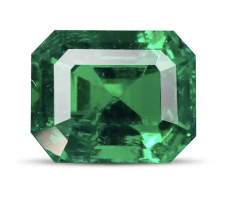 A large, emerald-cut green gemstone, likely an emerald, with a vibrant, rich color and intricate facets.