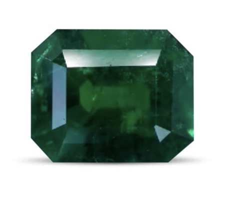 Precious emerald cut emerald gemstone with a deep green color on a white background.