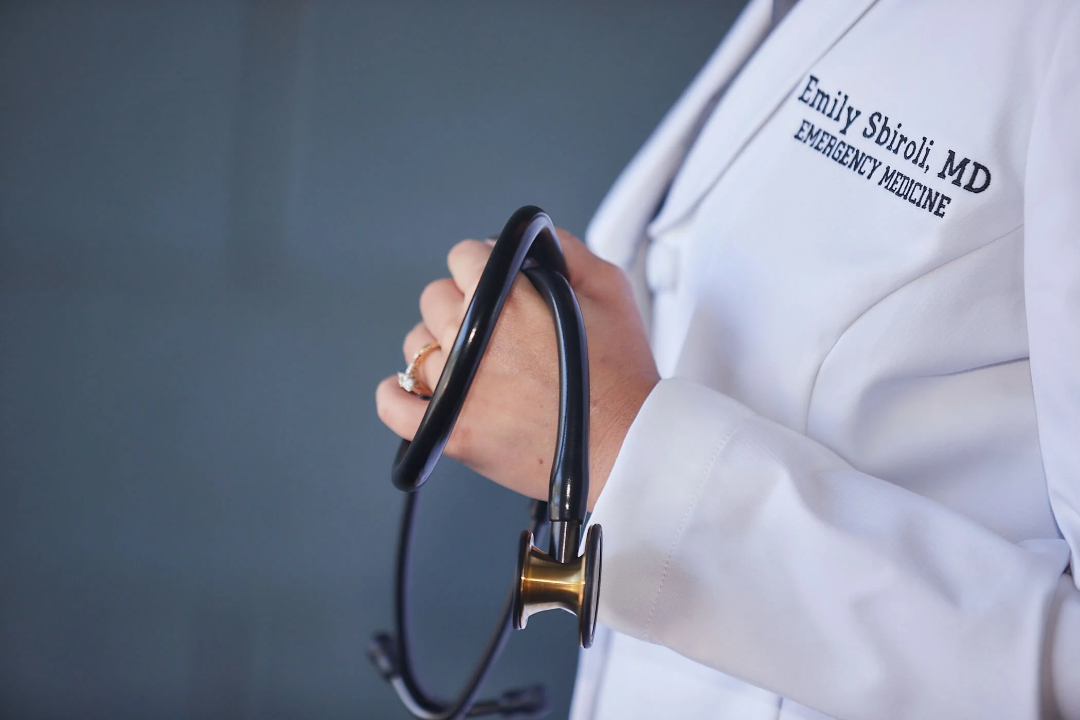 dr. emily sbiroli white coat and stethoscope