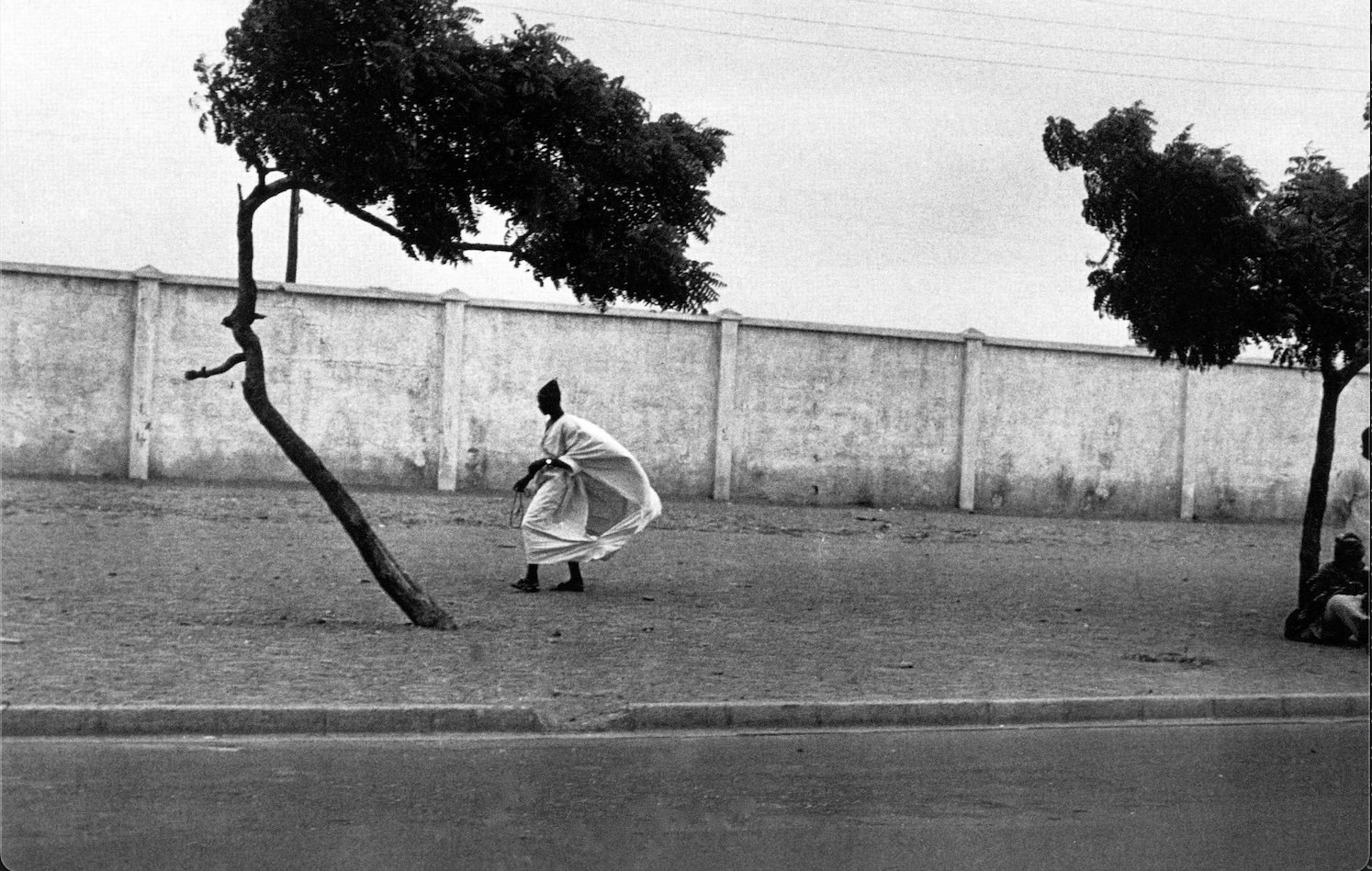 Ming Smith: Dakar Roadside with Figures, 1972, Archival pigment print.
11 x 14 in.