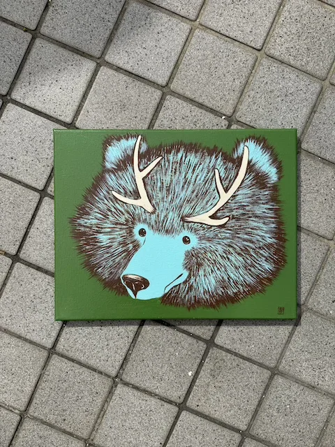 Wolf with antlers on green background.webp