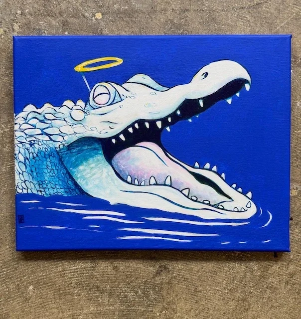 Angelic alligator on blue background.webp