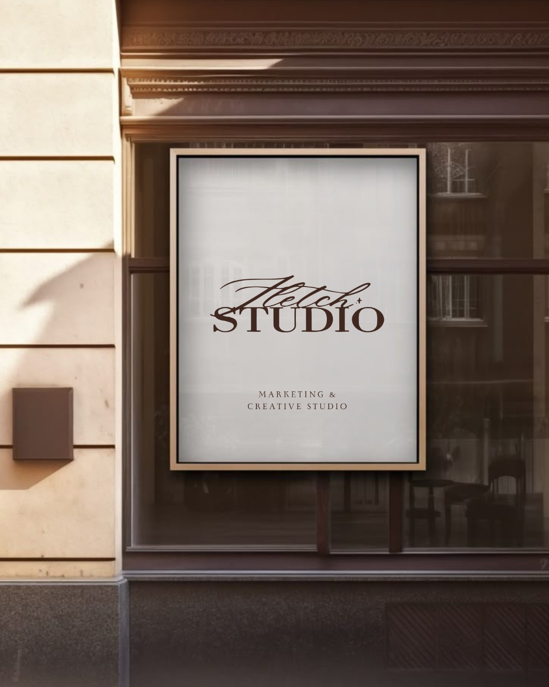 Sign for Fletch Studio, a marketing and creative studio, on a building window (Mock up)