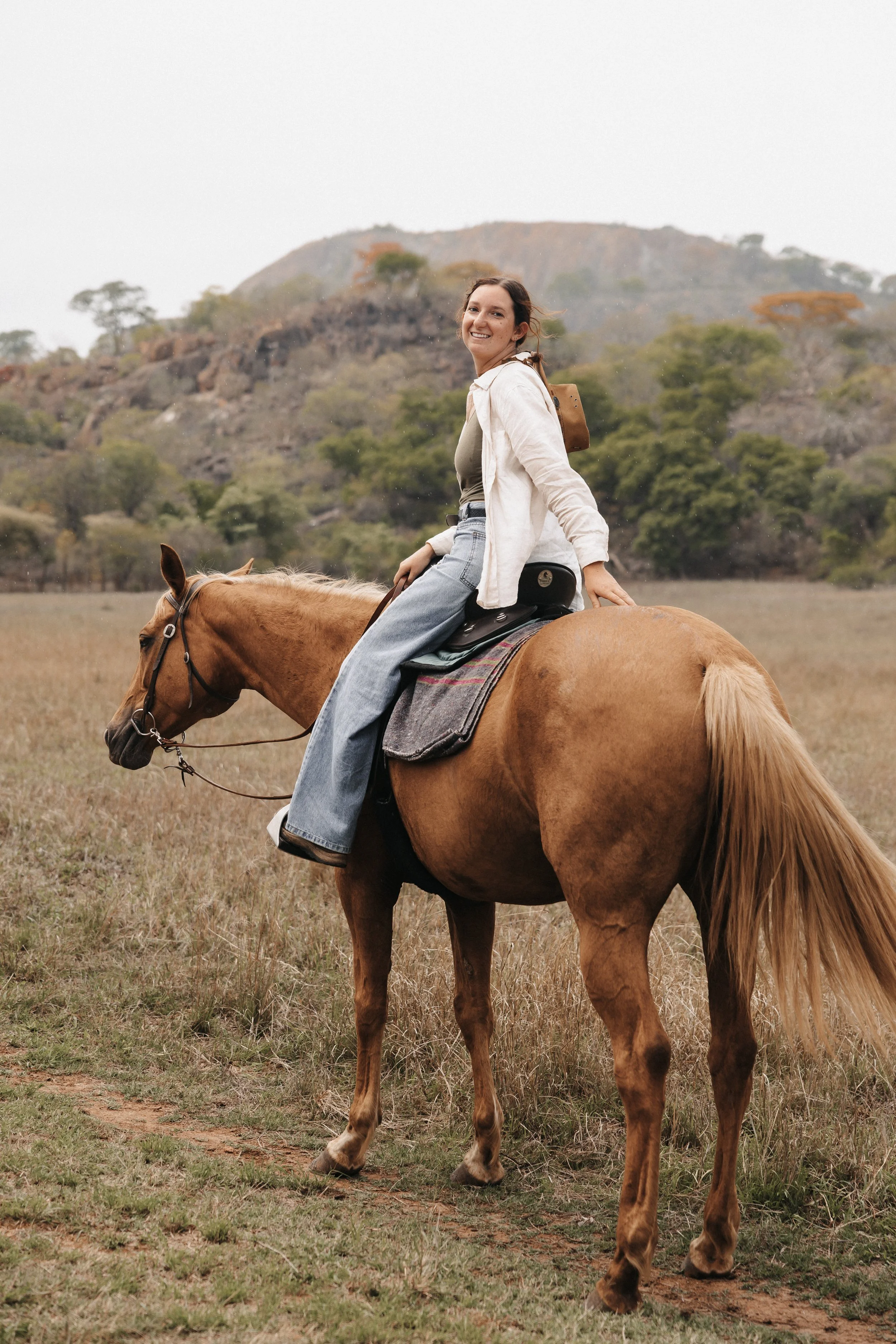 Young girl on a pretty horse smiling