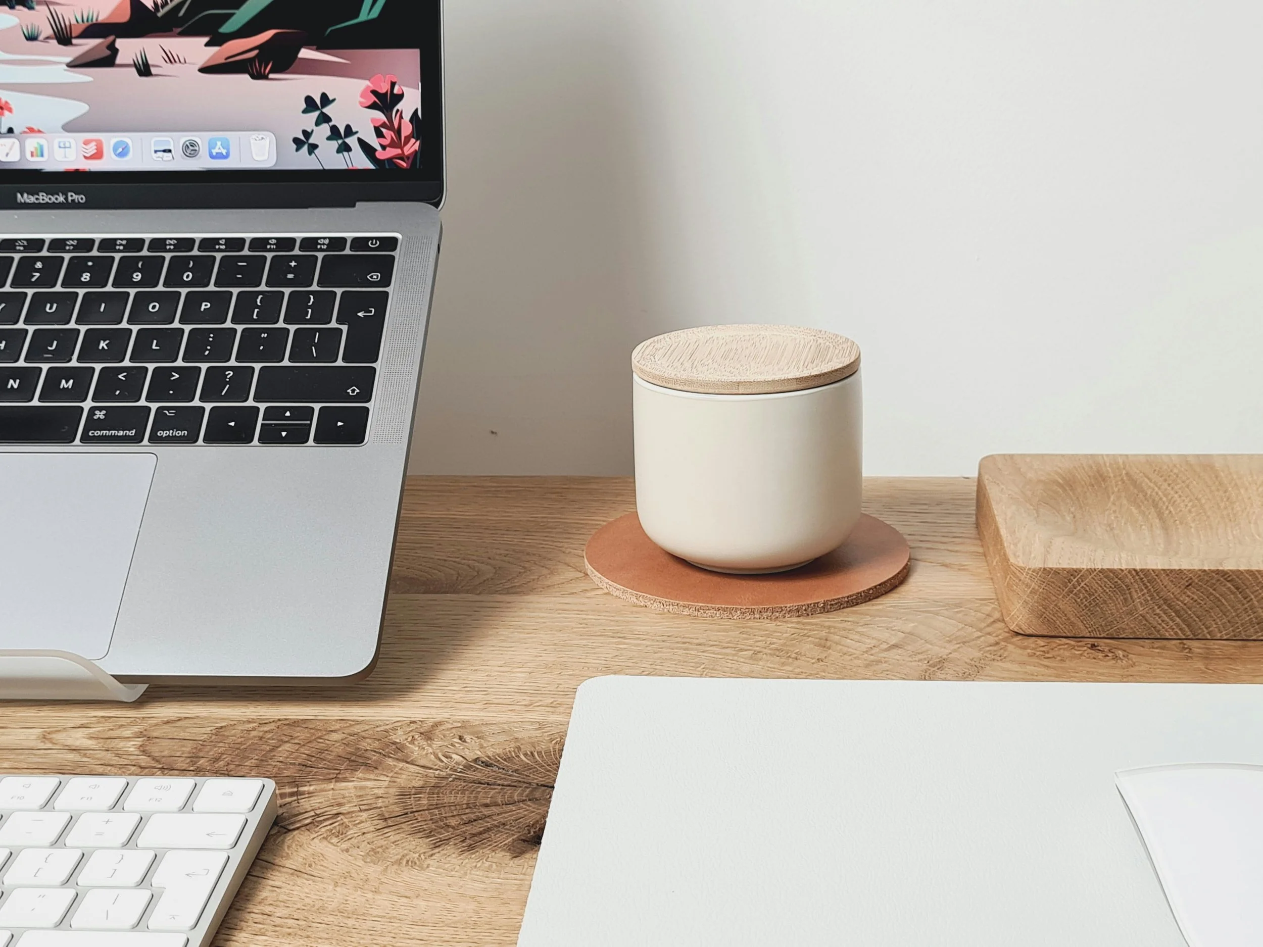 Calm desk setup with laptop and candle