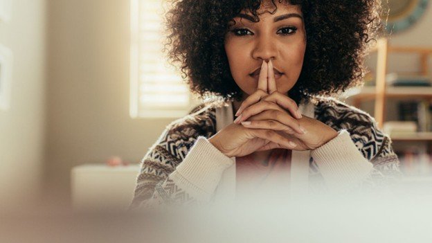 A woman pondering her thoughts.