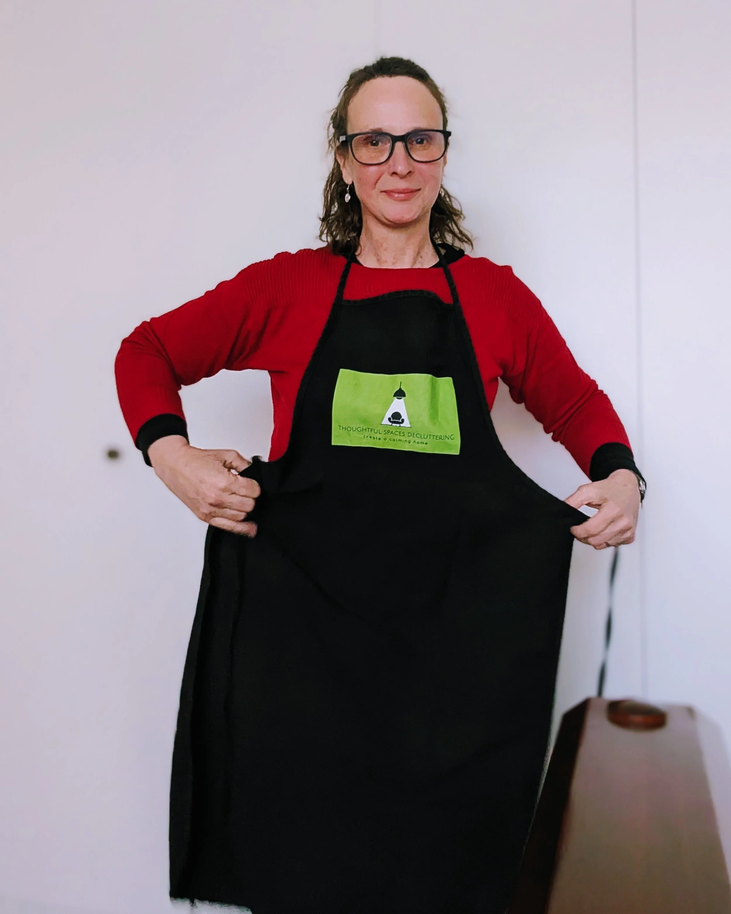 Bonny founder Thoughtful Spaces Decluttering putting on her uniform