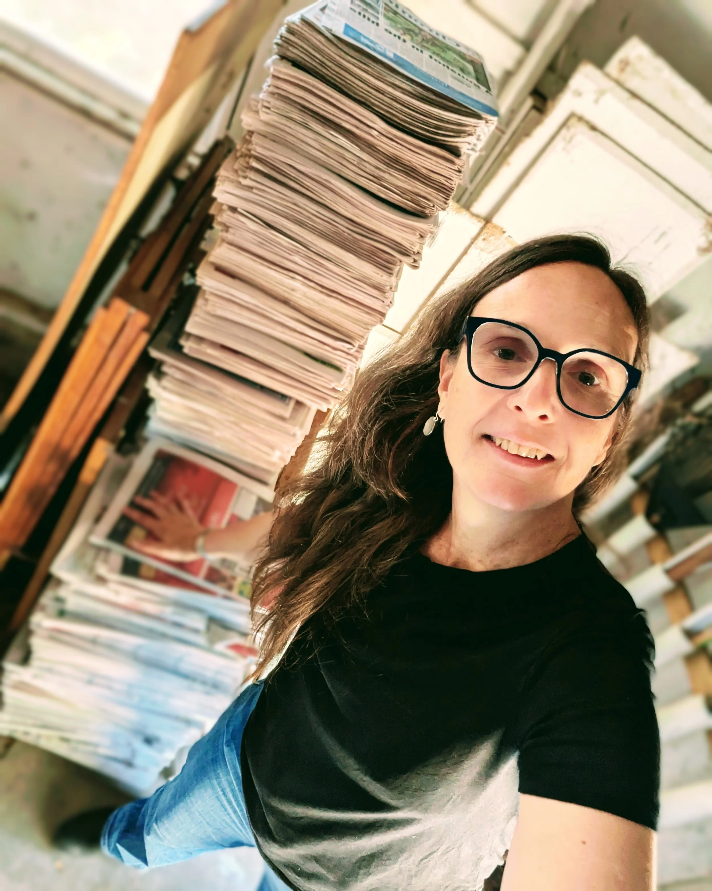 Bonny with new reclaimed newspapers saved from landfill, to use as packing for her clients