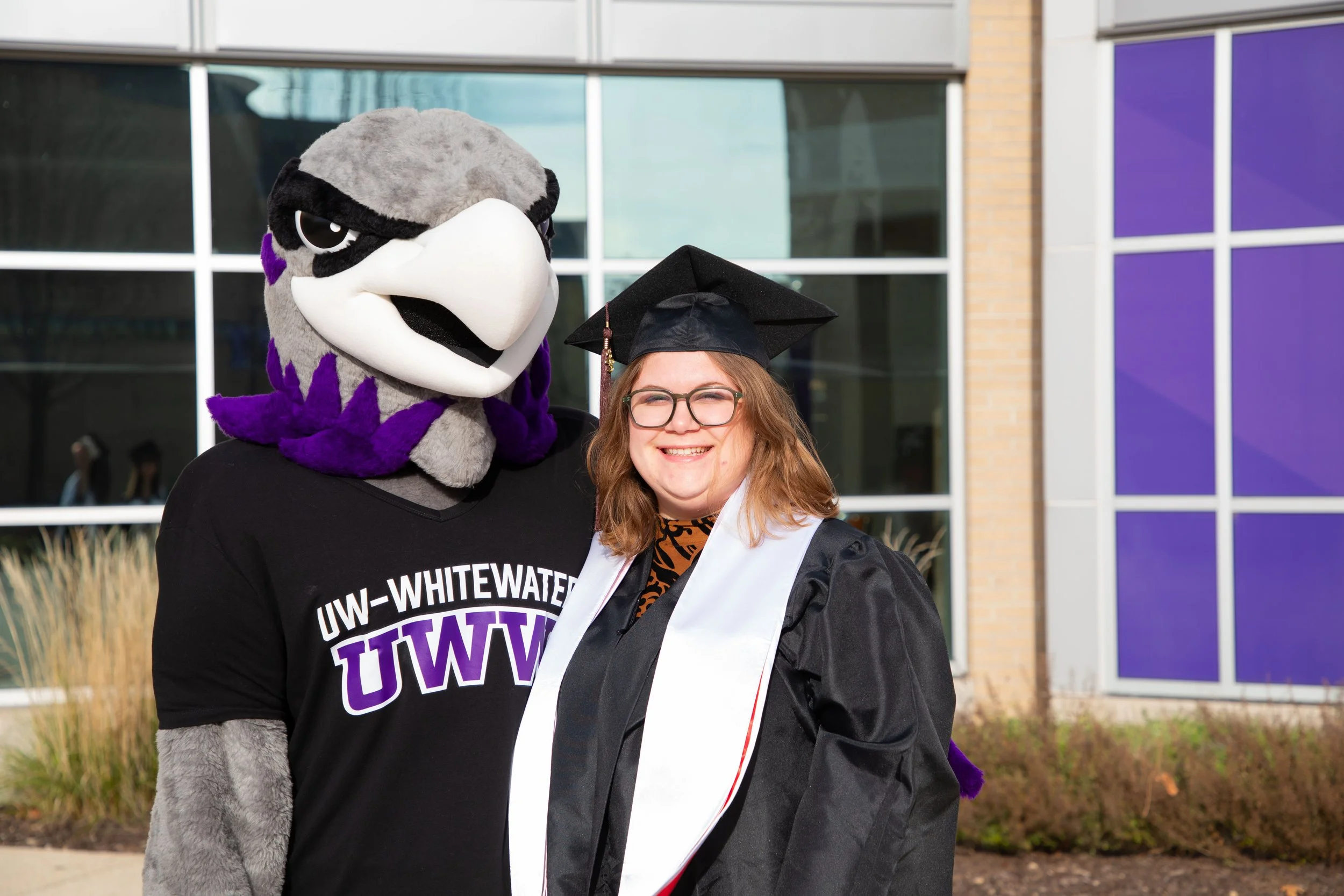 UWW's University Center's Student Employee, Class of December 2023, with UWW's school mascot Willie the Warhawk.