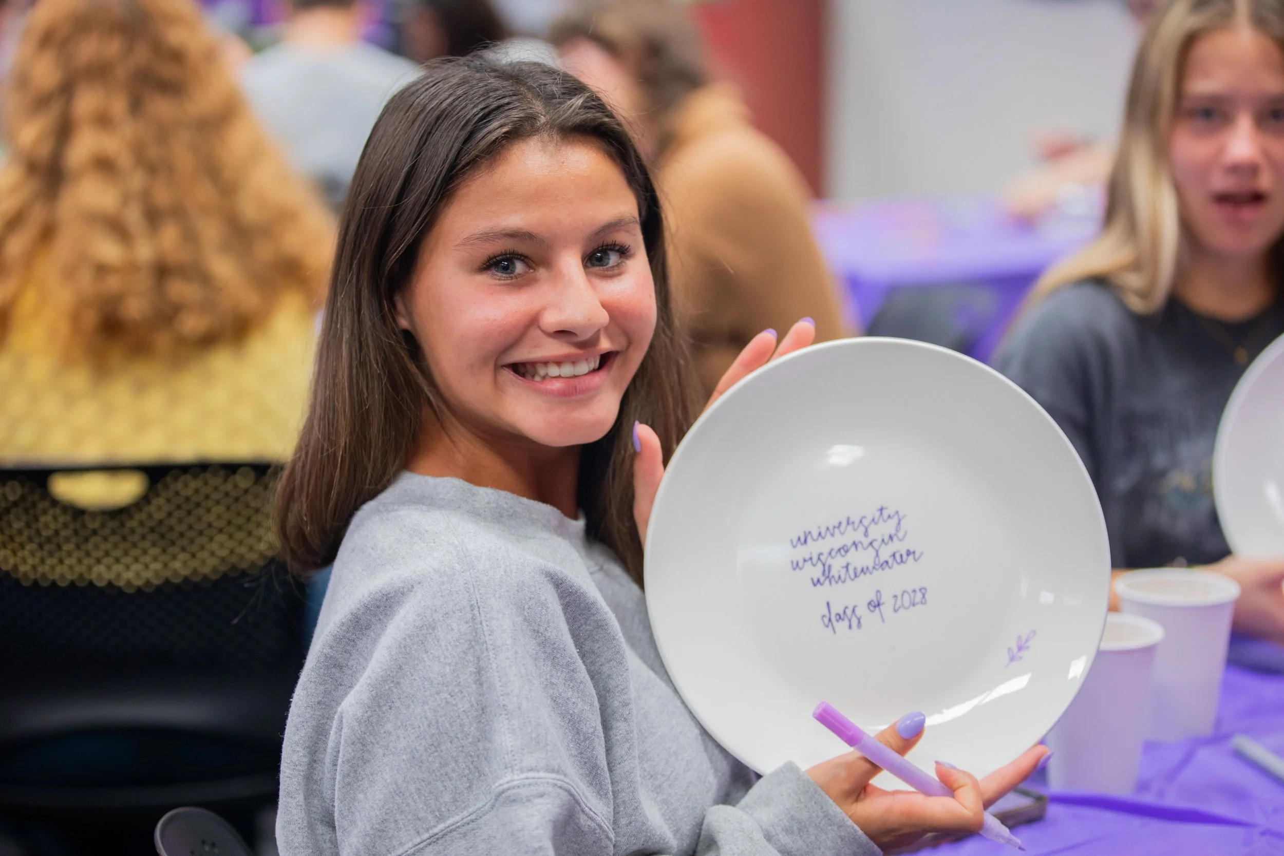 Student during a UCLive sponsored Plate Painting Art Workshop in UWW's University Center's Warhawk Connection Center, 2024.