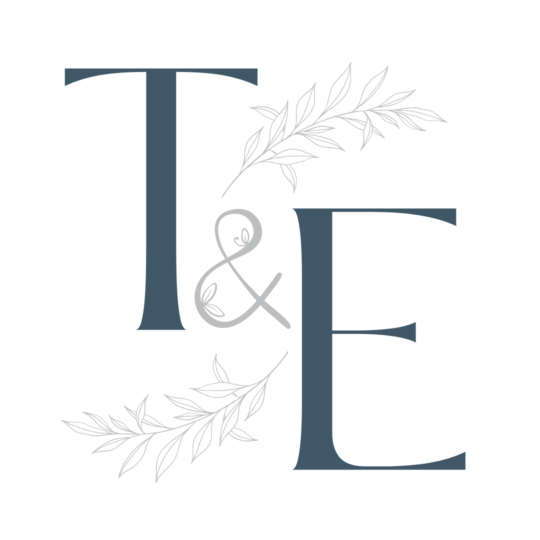 Stylized letters "T & E" with decorative leaves.