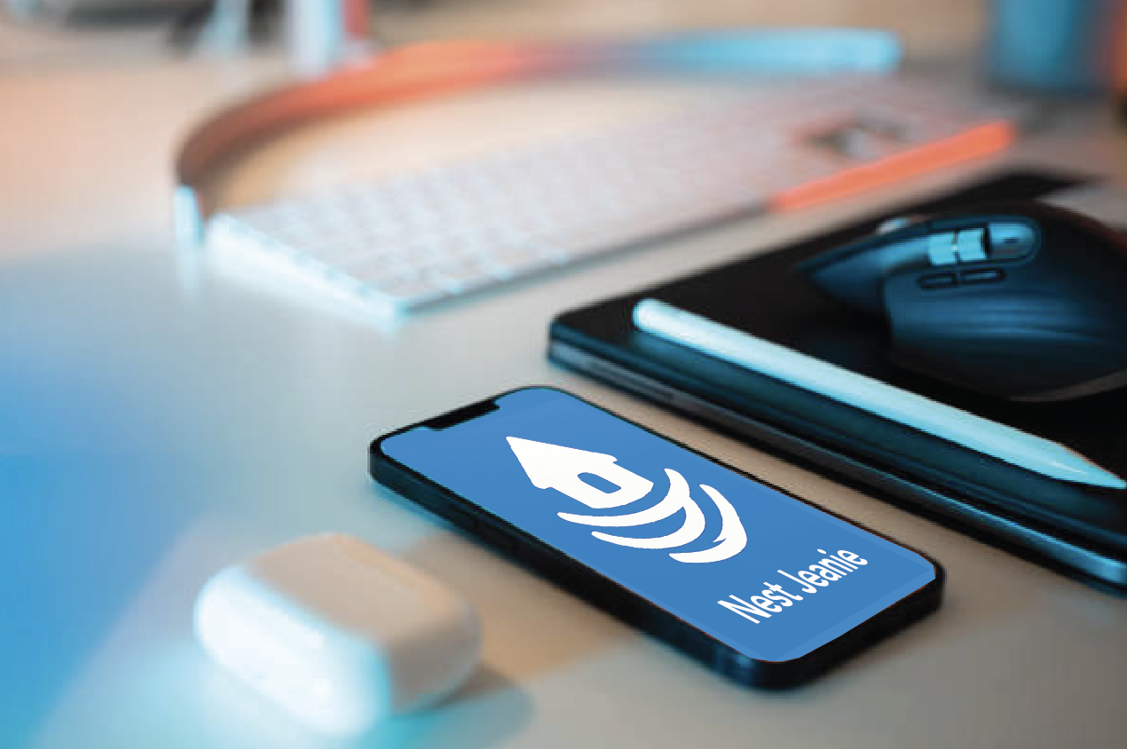 Smartphone on a desk with the Nest Jeannie app logo displayed on the screen, surrounded by a mouse, a tablet, and a keyboard.