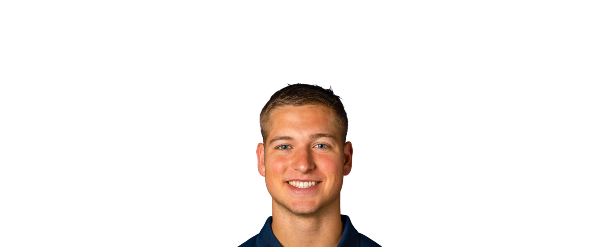 Portrait of a smiling person against a black background.