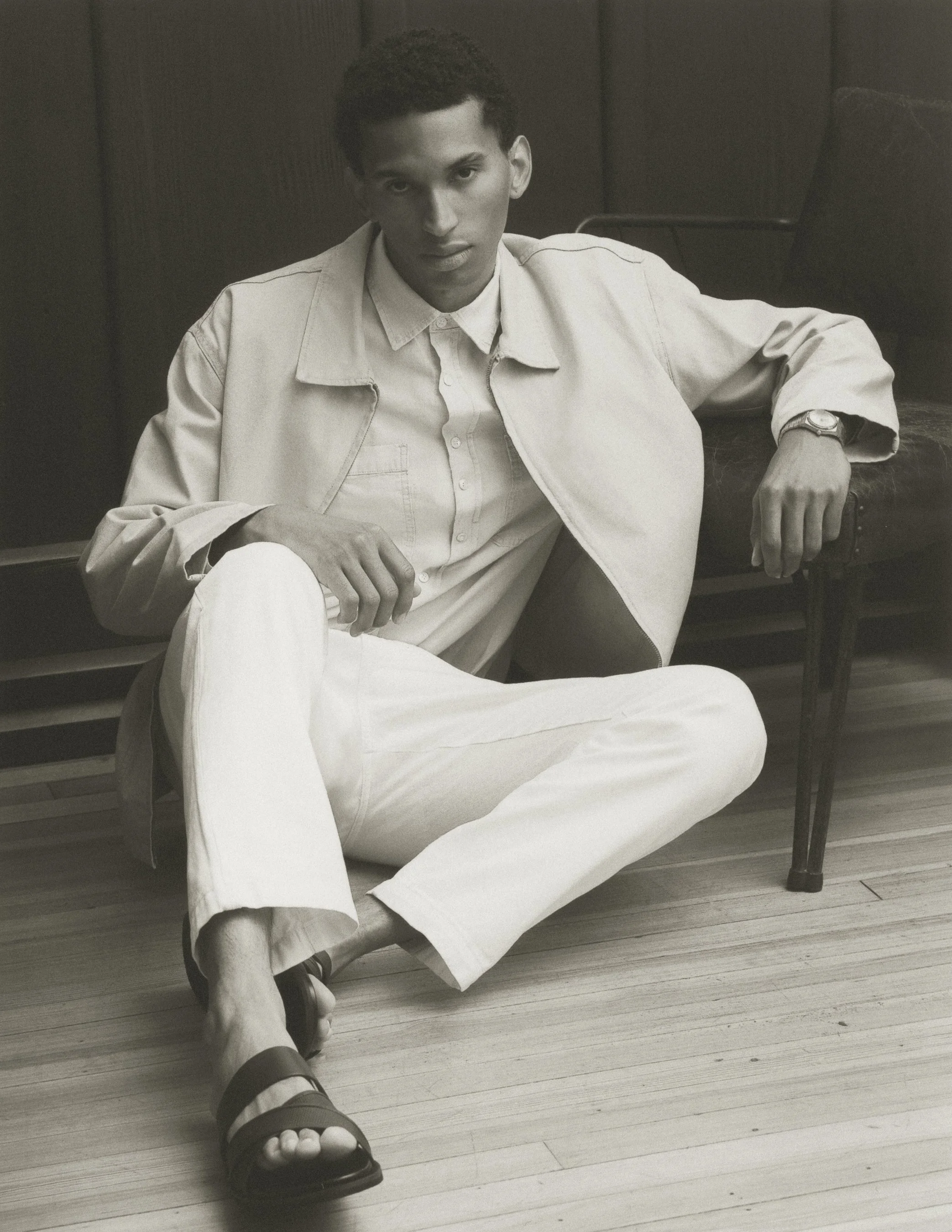 Austin model Wolfgang Burst wearing a grey suit in an Austin studio
