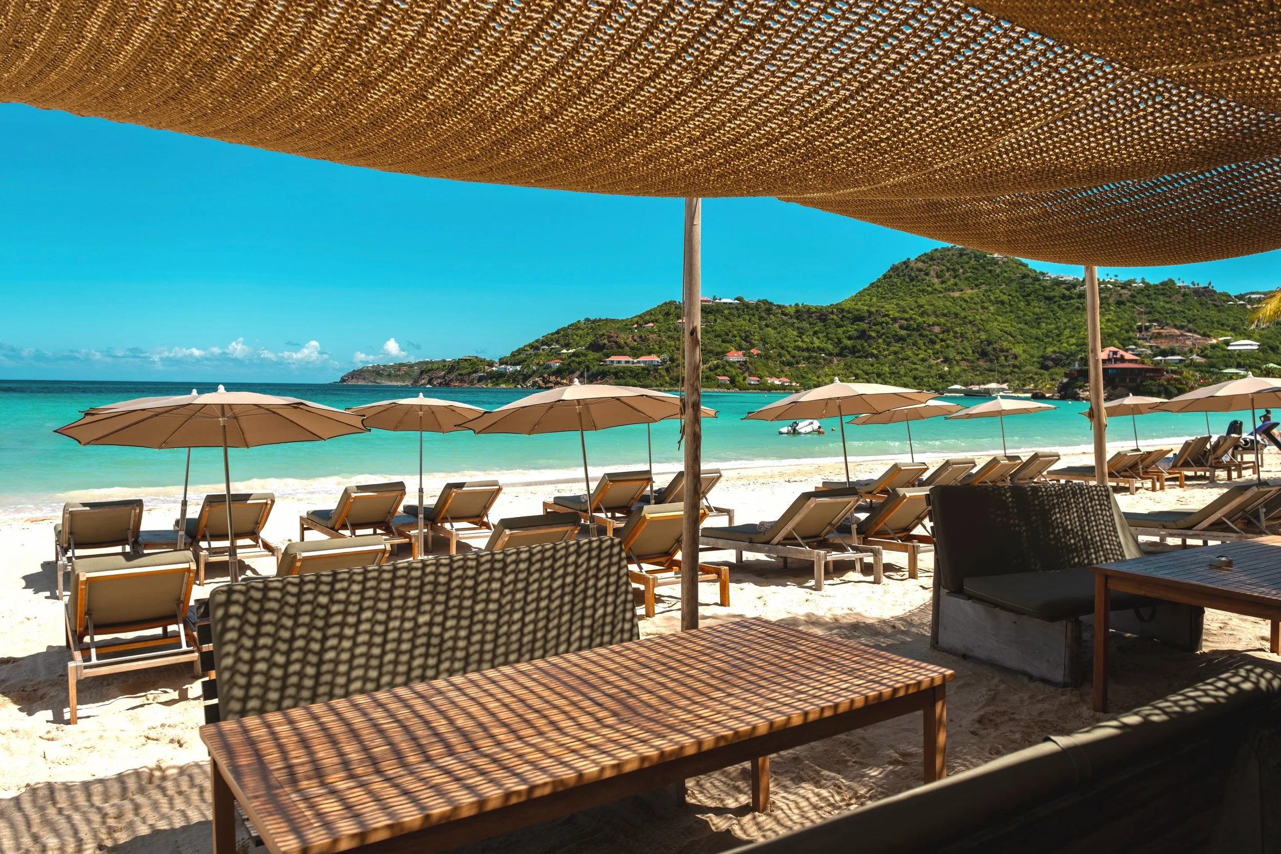 A little shade, a little sunshine, and endless views over Saint Jean.

Your spot at Pearl Beach is waiting. ☀️