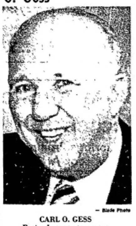 Black and white photo of a smiling, bald man in a suit with a tie, identified as Carl O. Gess.