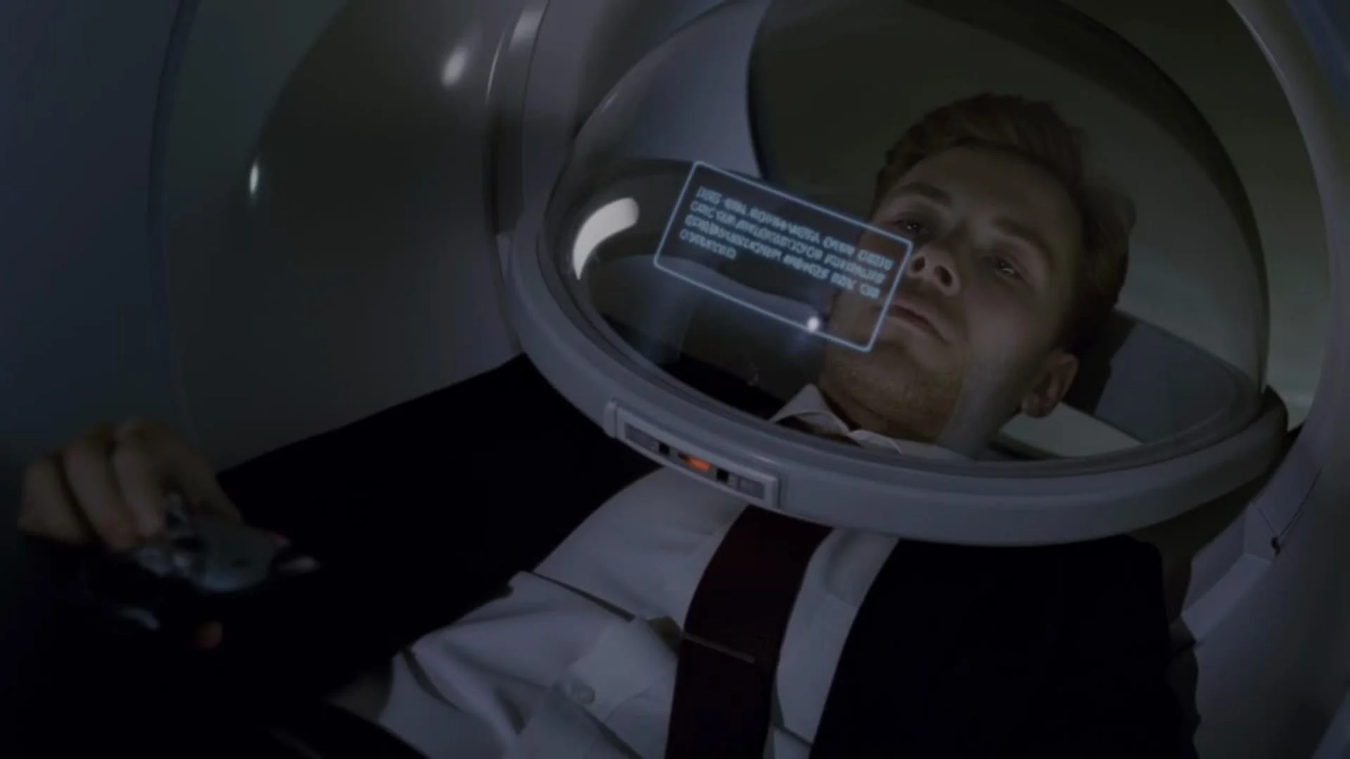 Image of Joe being asked interview questions under an MRI scanner
