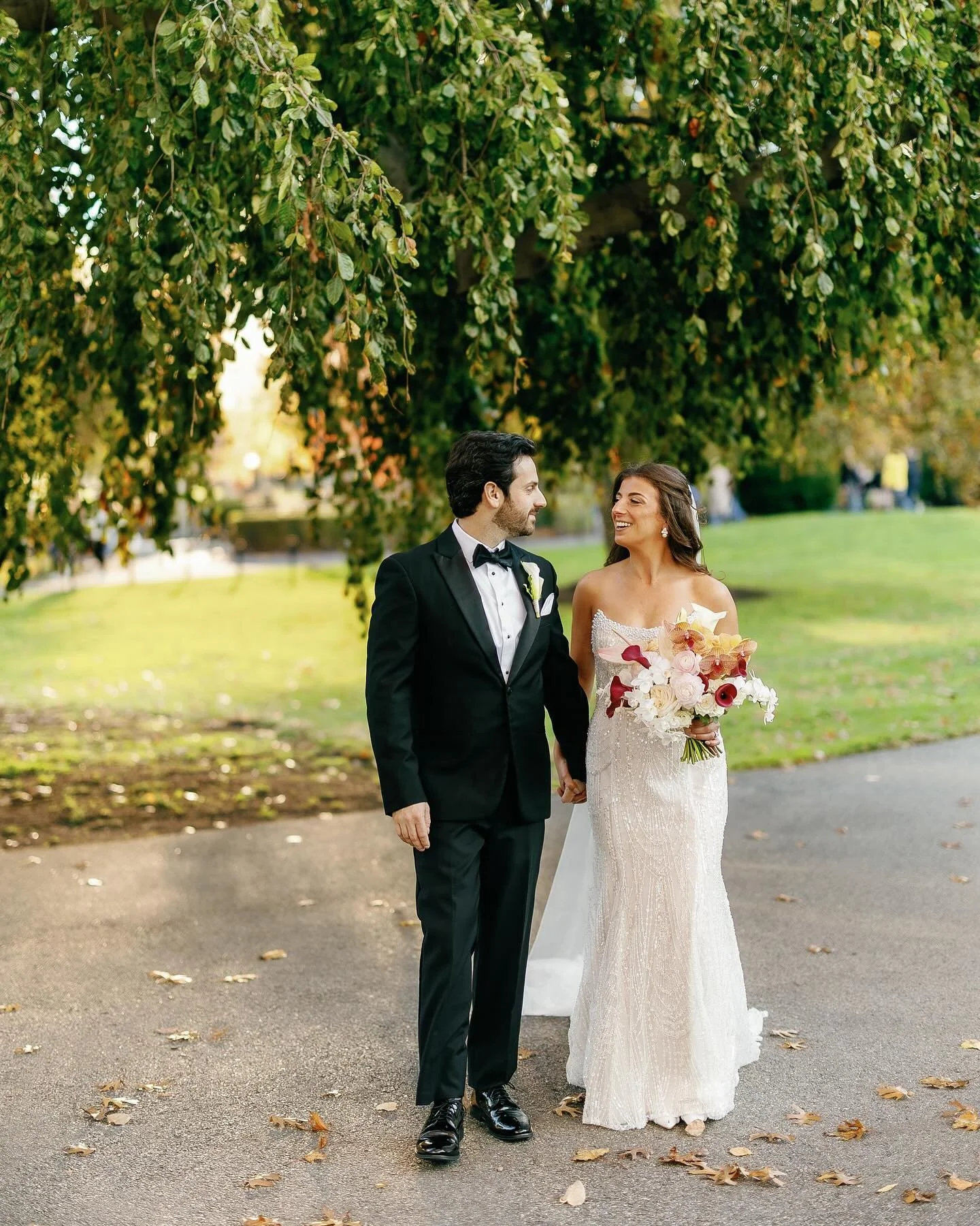 Zoe&rsquo;s bouquet was most definitely a favorite of 2025. I&rsquo;m talking spilling orchids, calla Lily, dahlias, ranunculus and more. Not to mention their color palette bringing in the prettiest autumnal tones of pink and orange, which Zoe wears 