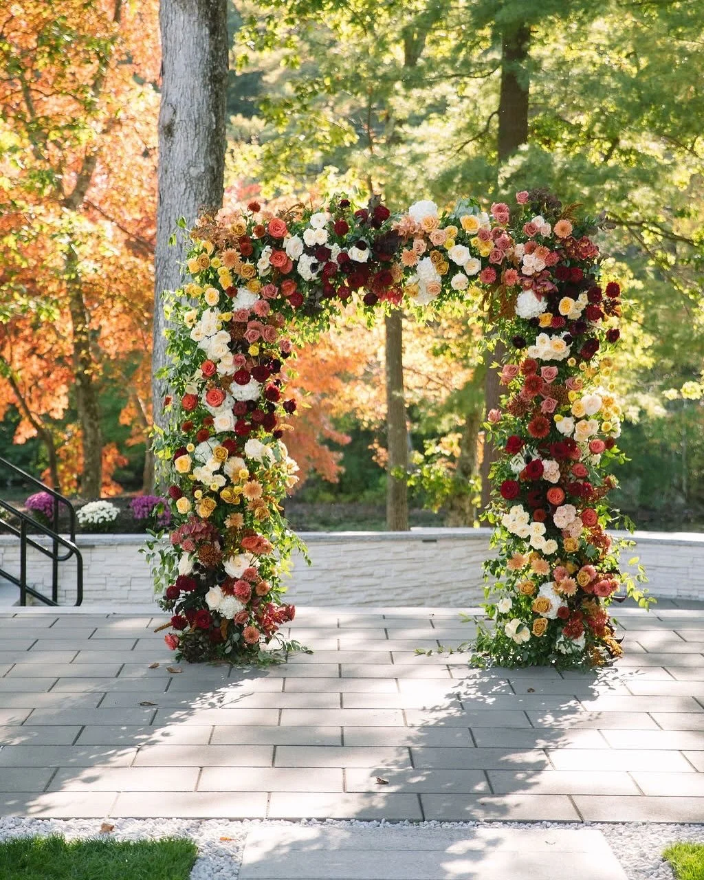 I simply cannot and will not ever move past this beautiful arch abundant with autumn beauty. Colors moving from plum and burgundy all the way to a creamy yellow with earth tones and rosey hues in-between. Not to mention an all star flower list! Such 