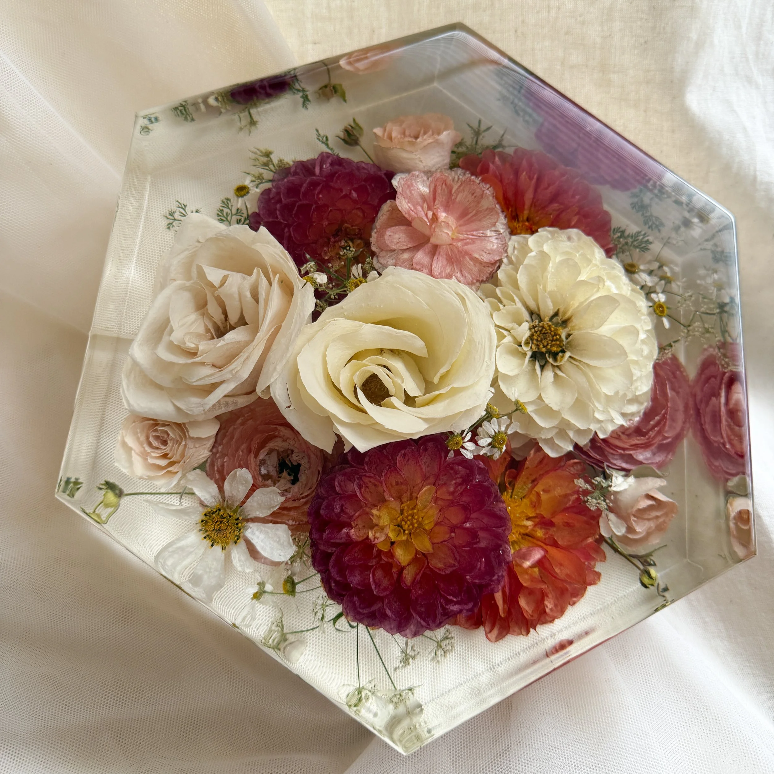 8-inch resin hexagon featuring preserved ivory and blush roses with pink, red, and white flowers
