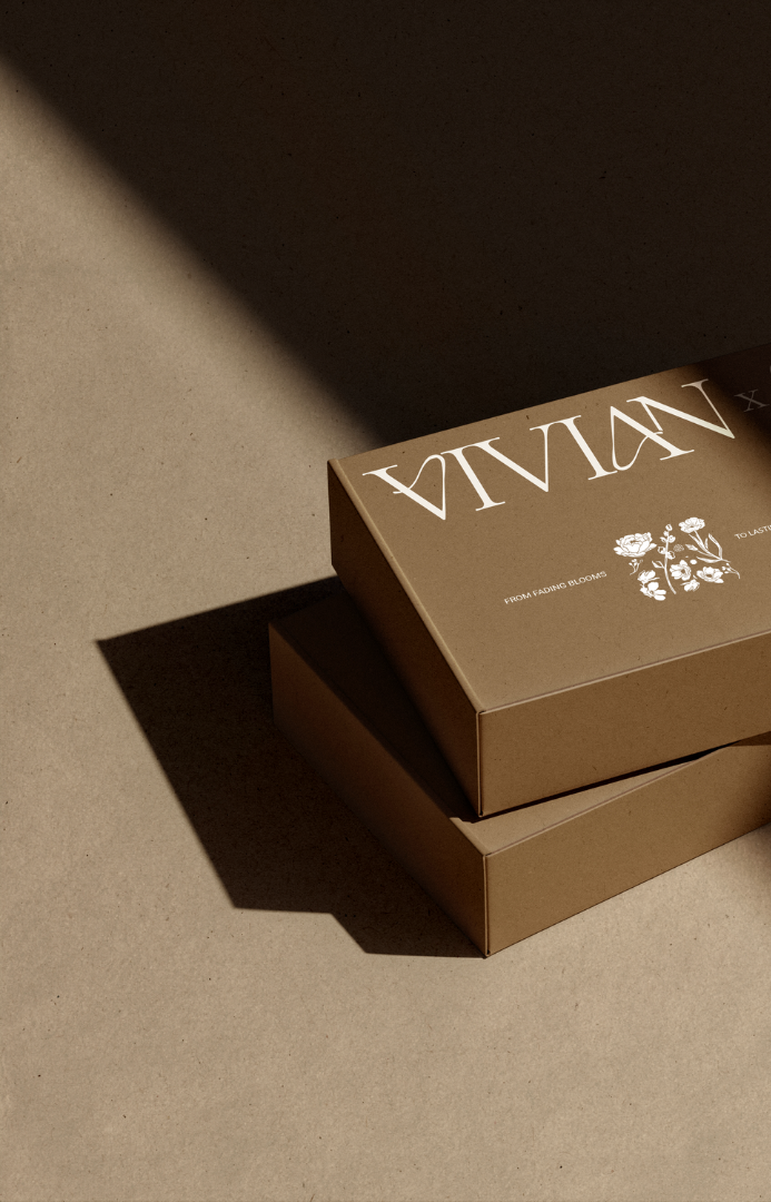 Close-up of a shipping box with VIVIANxCO branding on it