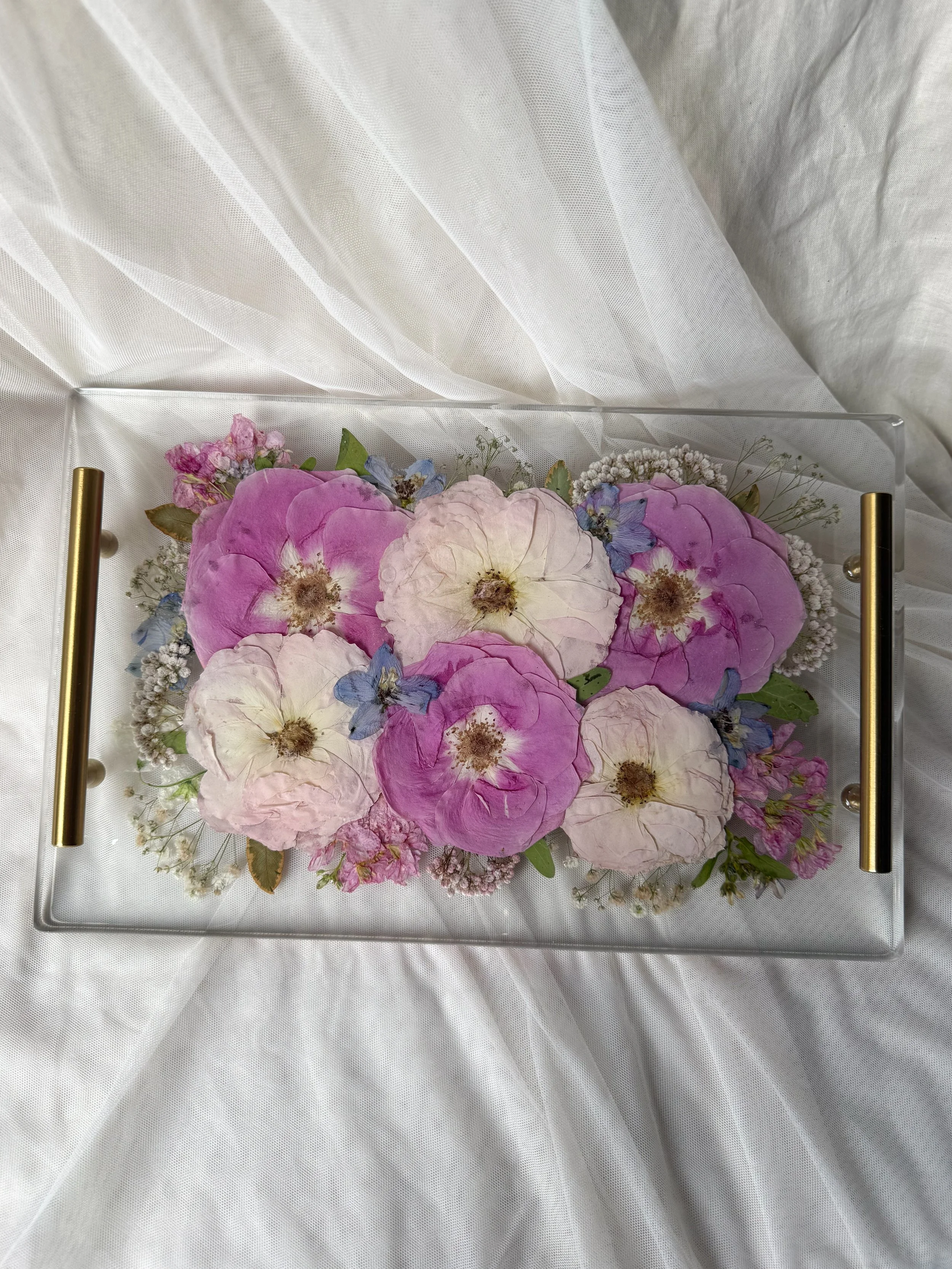 Large rectangle resin tray featuring preserved pink, lavender, and white flowers with gold handles