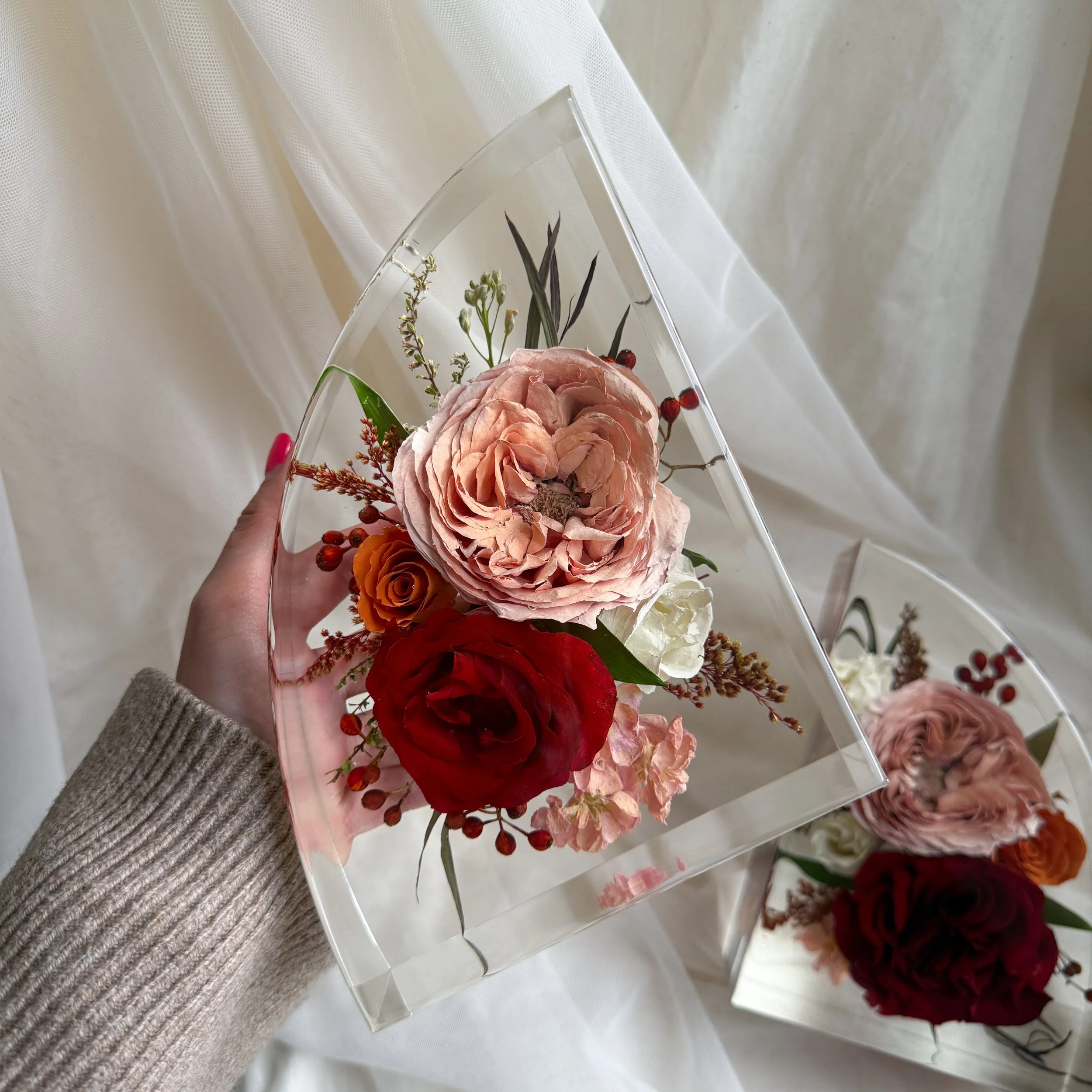 Handmade 7-inch resin floral bookends with preserved red roses, peach flowers, and delicate greenery