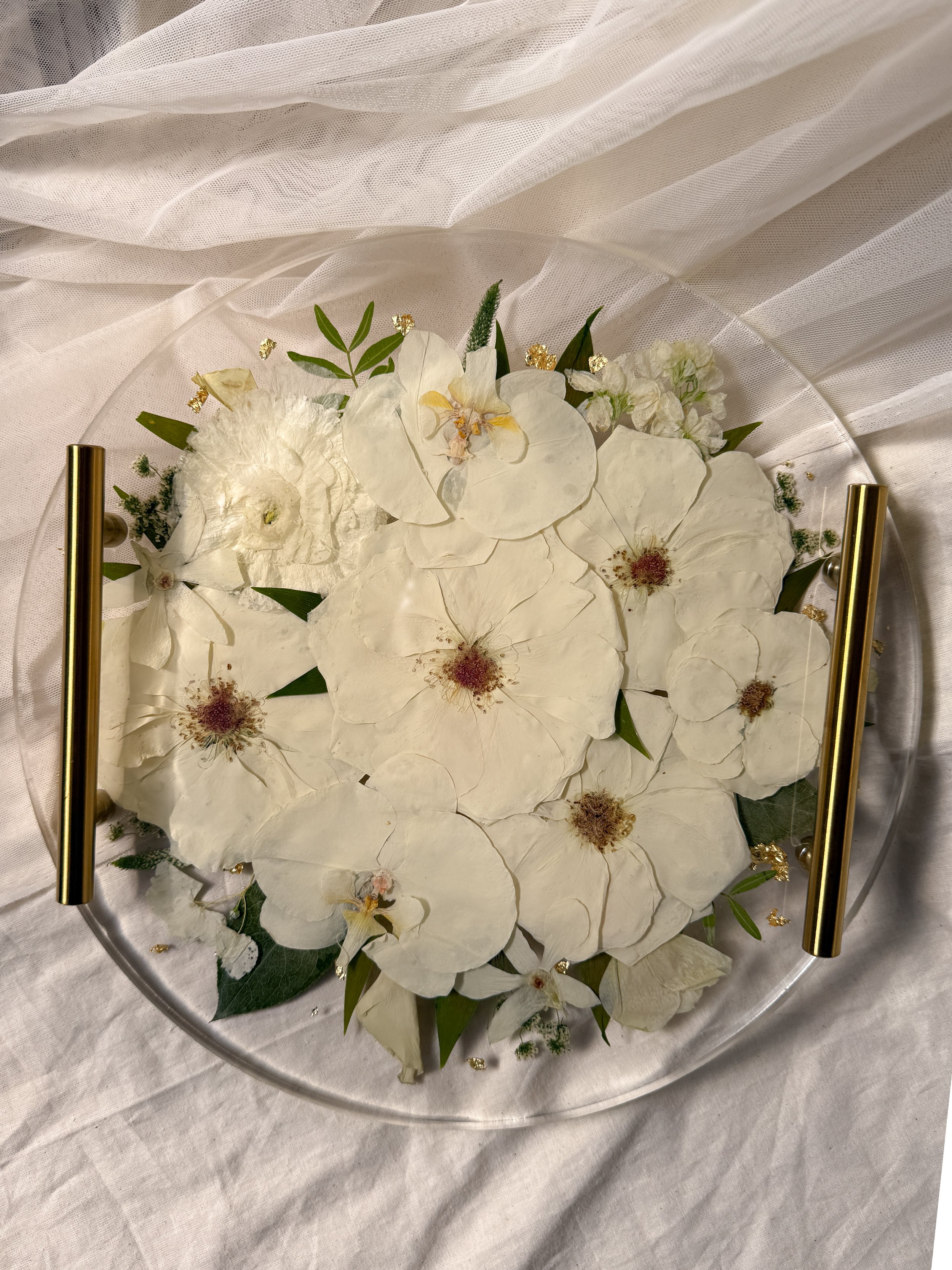 12-inch circle resin tray with gold handles preserving white flowers and green foliage