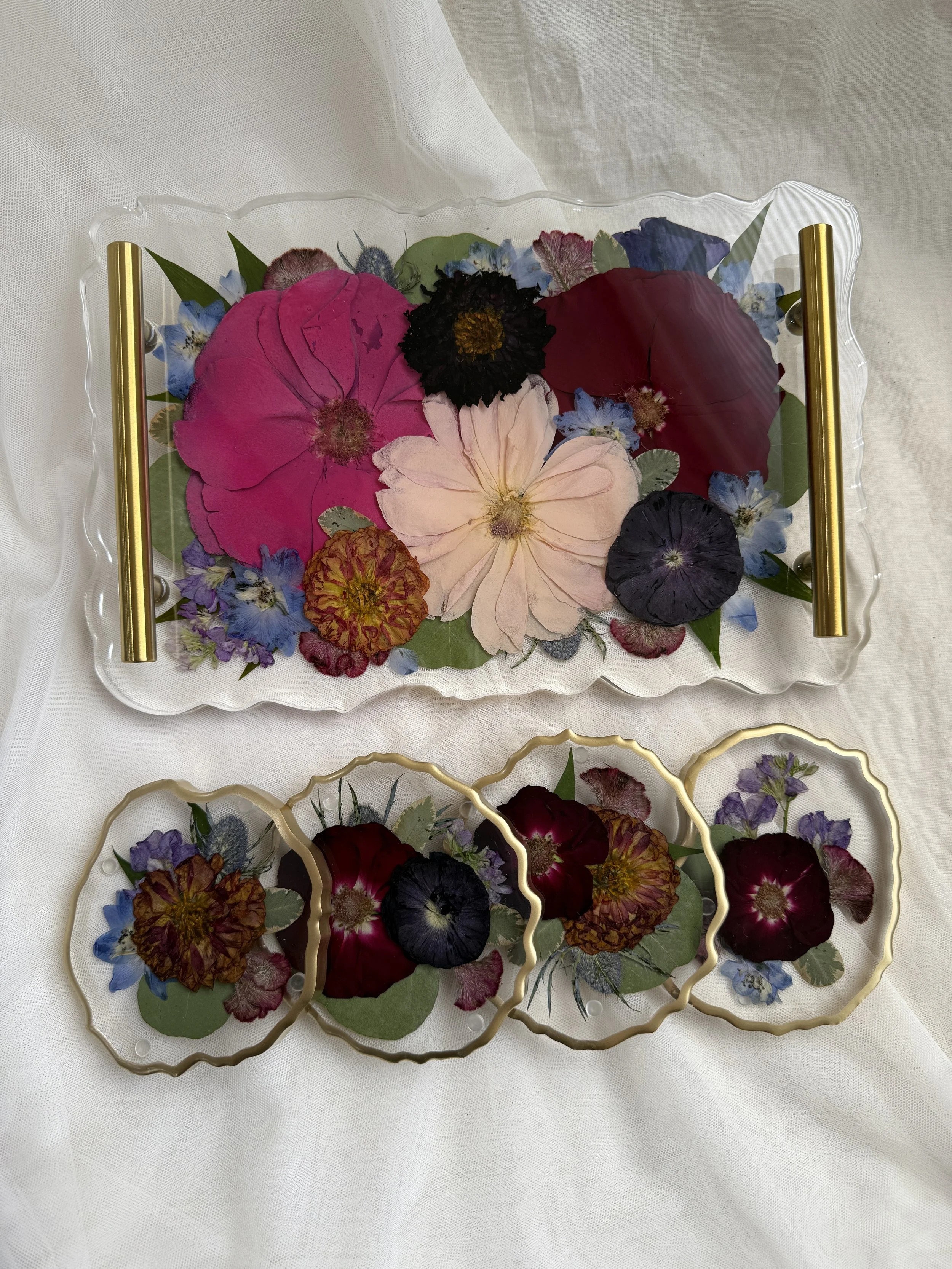Small geode resin tray with gold handles featuring bright pink, blush, red, and purple flowers with four matching floral geode coasters with gold rims