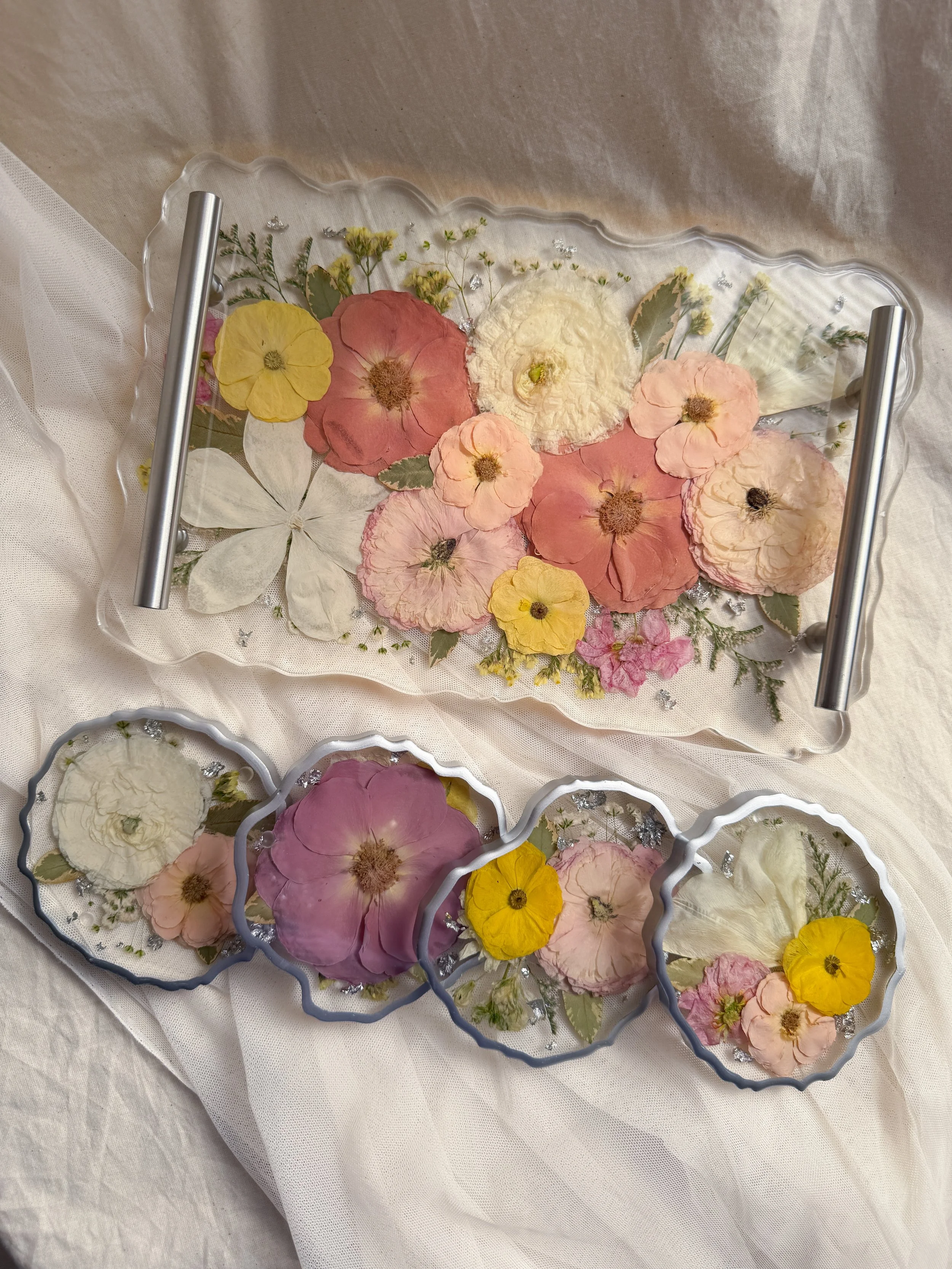 Small geode resin tray with silver handles preserving ivory, peach, and blush flowers with four matching floral geode coasters with silver rims