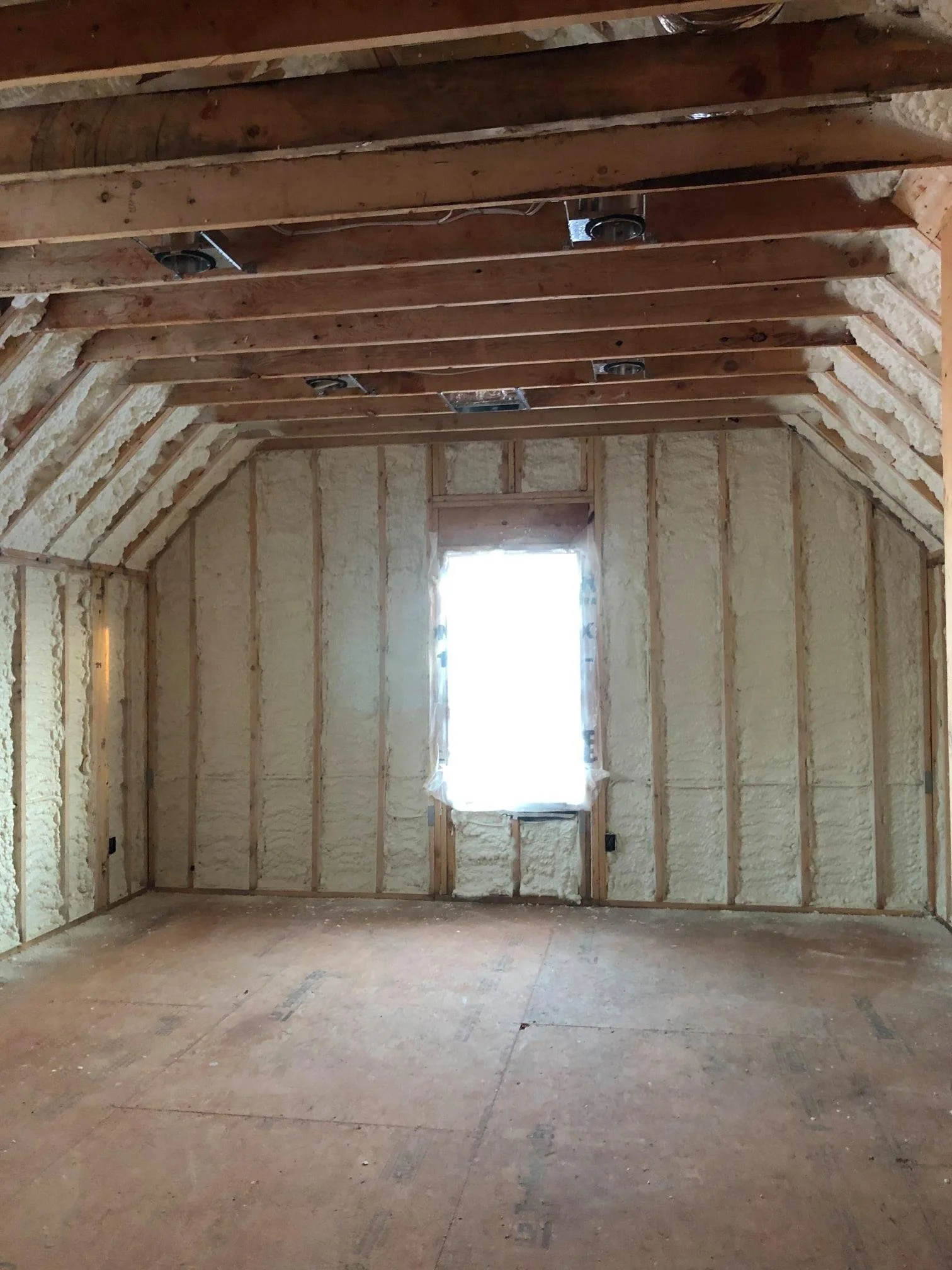 Expertly applied SPF (Spray Polyurethane foam). In a local building in Naples Florida