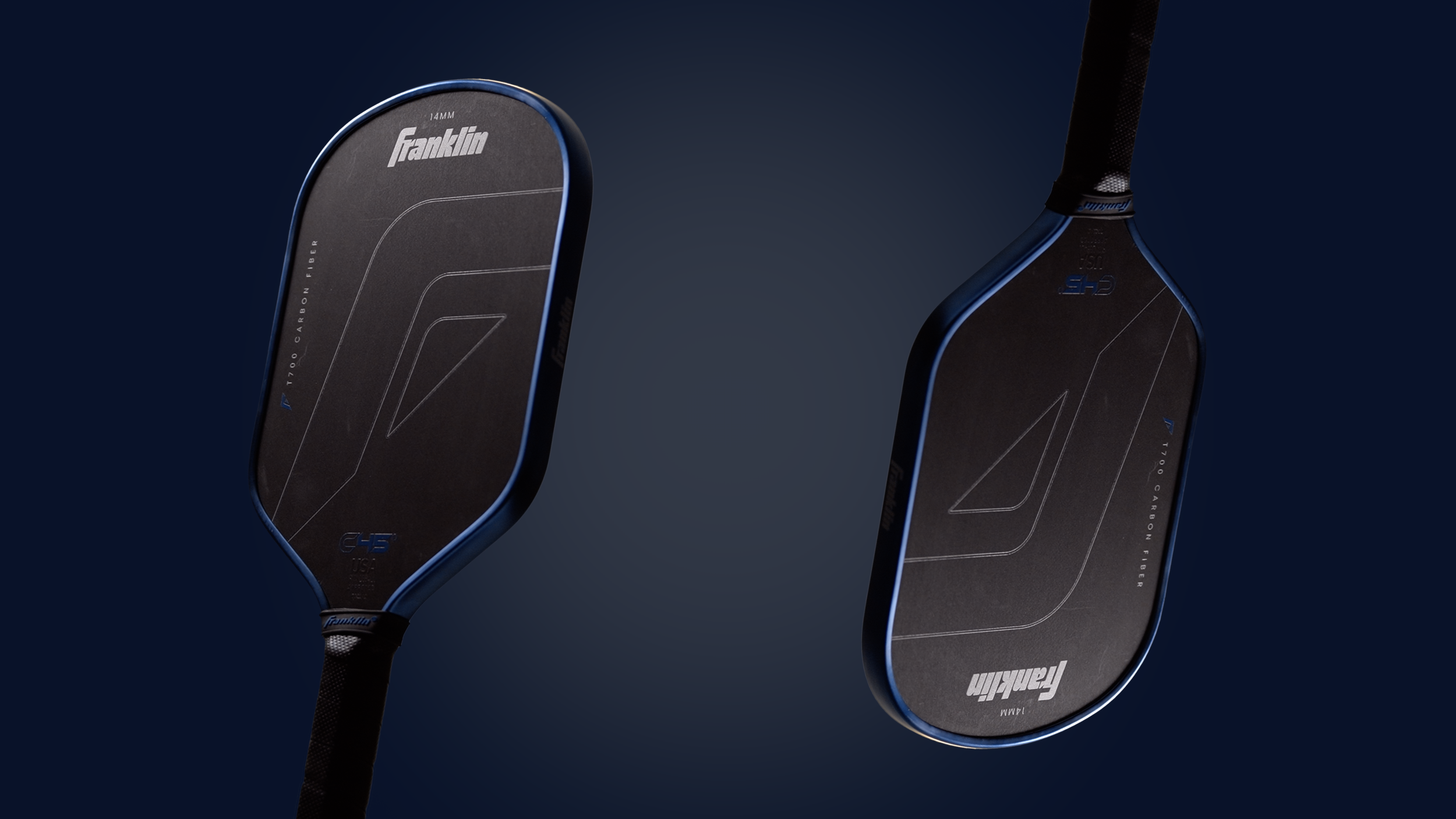 Two Franklin c45 pickleball paddles with black surfaces and blue edges, featuring T700 carbon fiber construction, shown against a dark background.