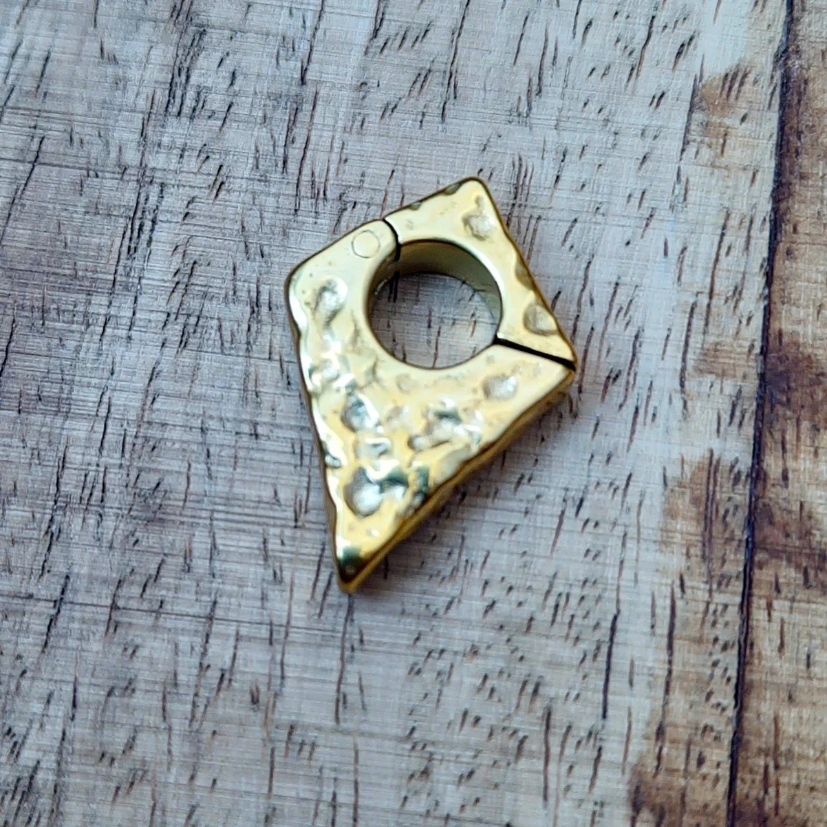Hammered arrow hanger for stretched ears with rugged texture. Shown in Gold PVD