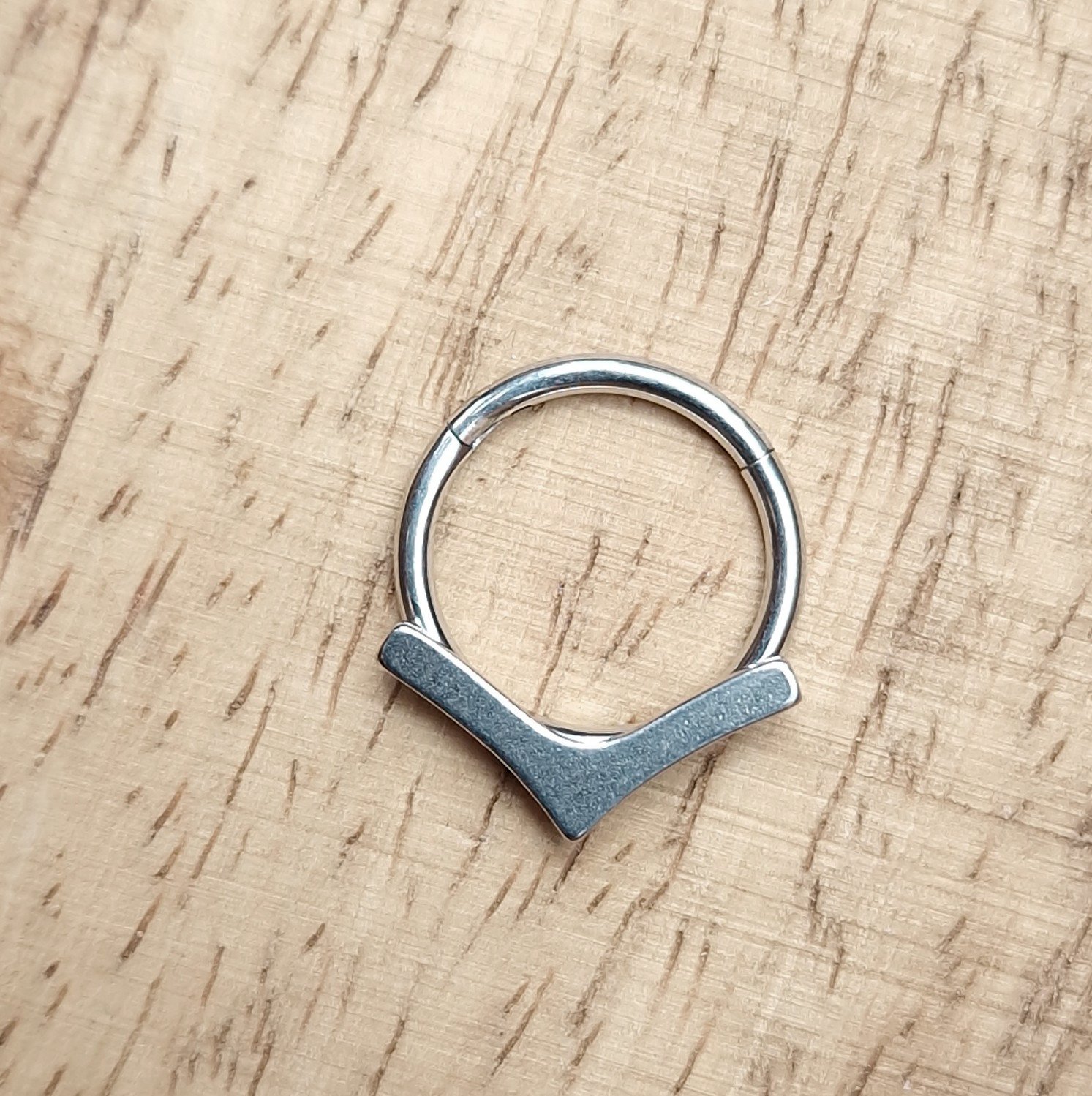 Ero's Aim titanium segment clickers, piercing ring with arrow shaped attachment. Titanium