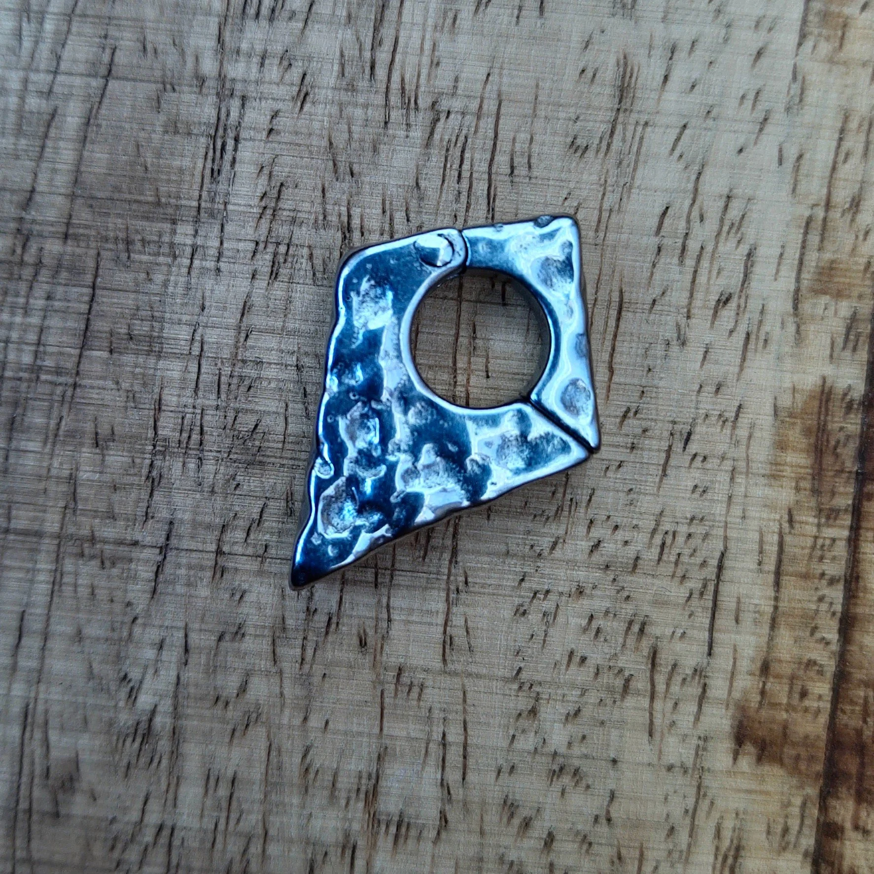 Hammered arrow hanger for stretched ears with rugged texture. Shown in Polished Steel