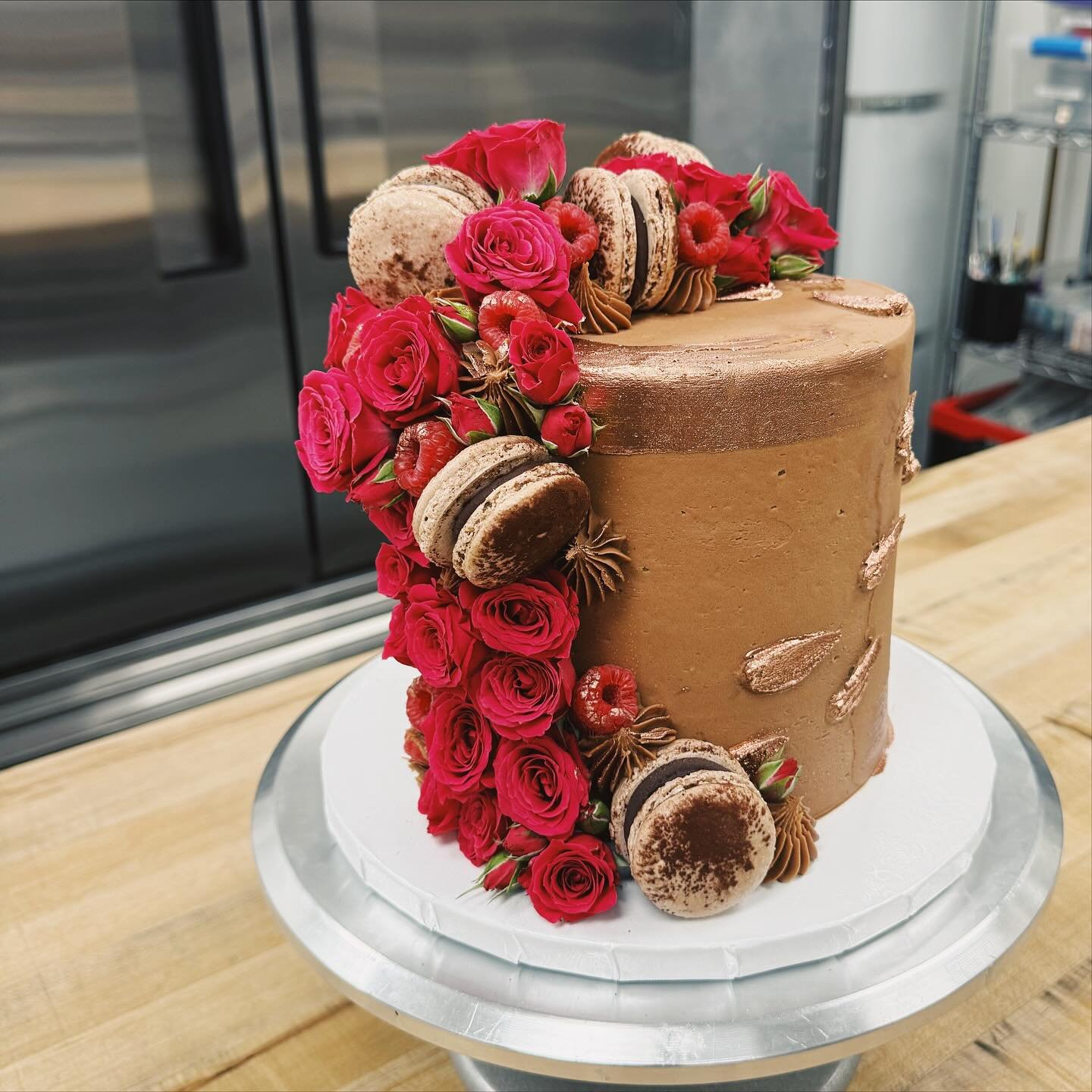 A custom birthday cake in our Chocolate Vanilla Classic flavor. 
Vanilla butter cake with a whipped chocolate buttercream for a birthday girl that loves raspberries and that classic nostalgic flavor of yellow cake with chocolate frosting 🍰🍫🌹
Swipe