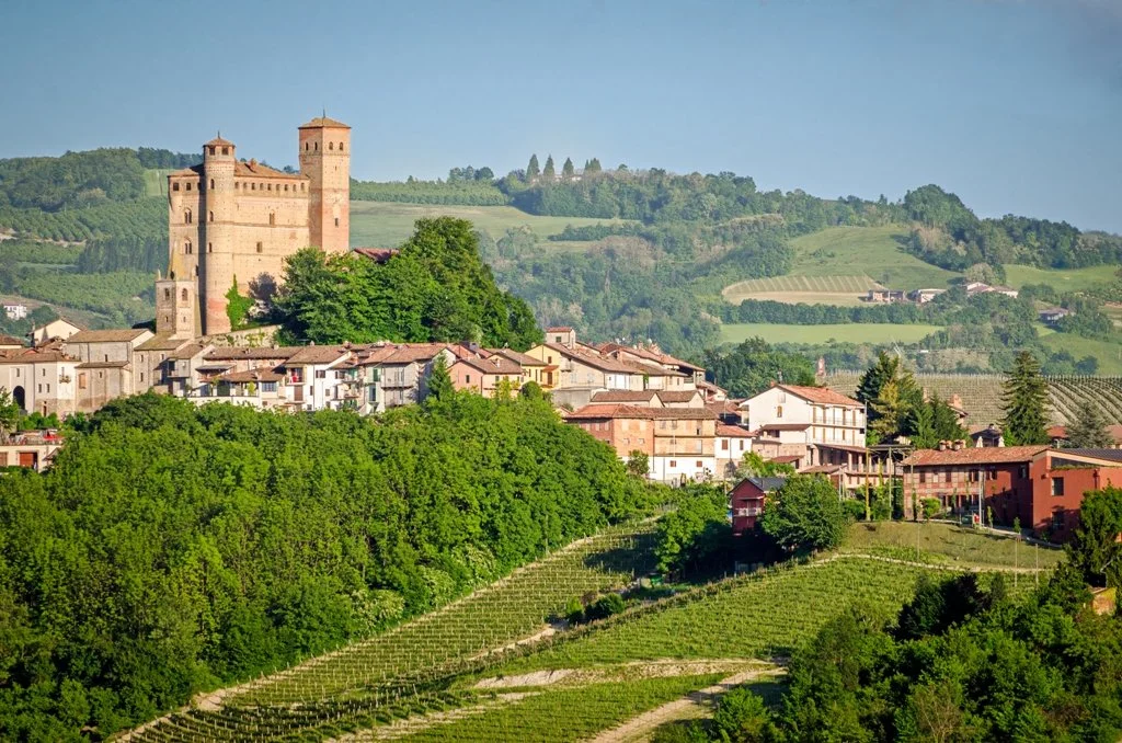 Castello di Serralunga d'Alba (Serralunga d'Alba Castle), a 14th-century fortress standing majestically over its historic village and the vineyard-covered hills of the Langhe region in Piedmont, Italy.