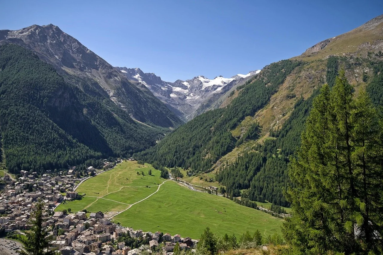 Scenic alpine village of Cogne and the vast Sant'Orso Meadow (Prato di Sant'Orso) in the Aosta Valley of Italy.