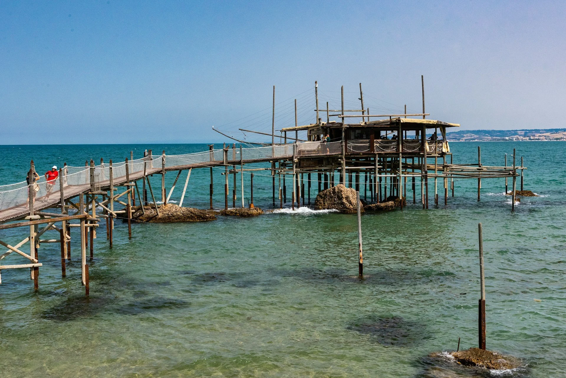 A traditional wooden fishing machine and stilt-house perched over the Adriatic Sea along the Trabocchi Coast (Costa dei Trabocchi) in the Abruzzo region of Italy.
