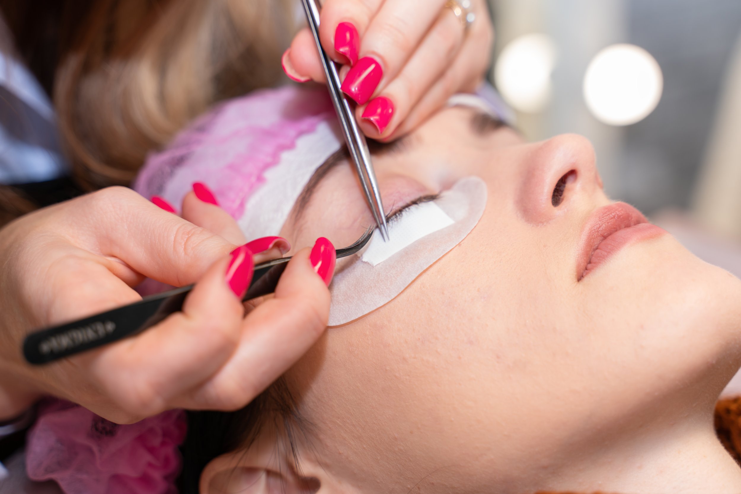 lashmaker-with-tweezers-glues-false-eyelashes-to-a-2025-03-09-06-14-26-utc.jpg