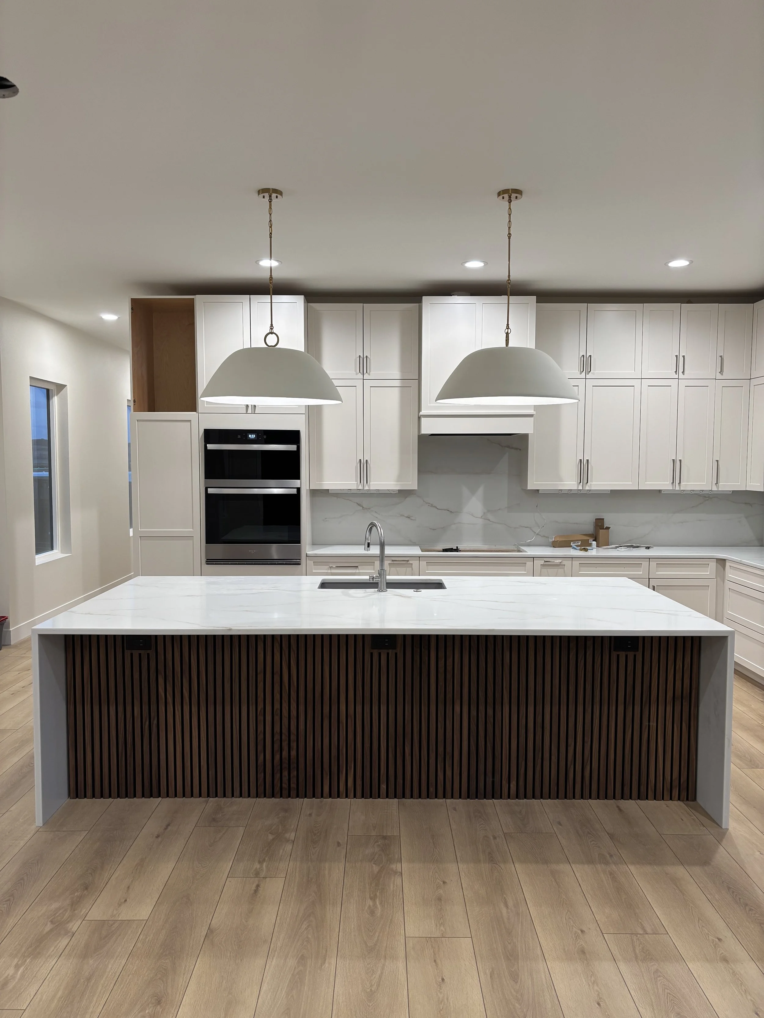 Photo of clean kitchen area in a new home