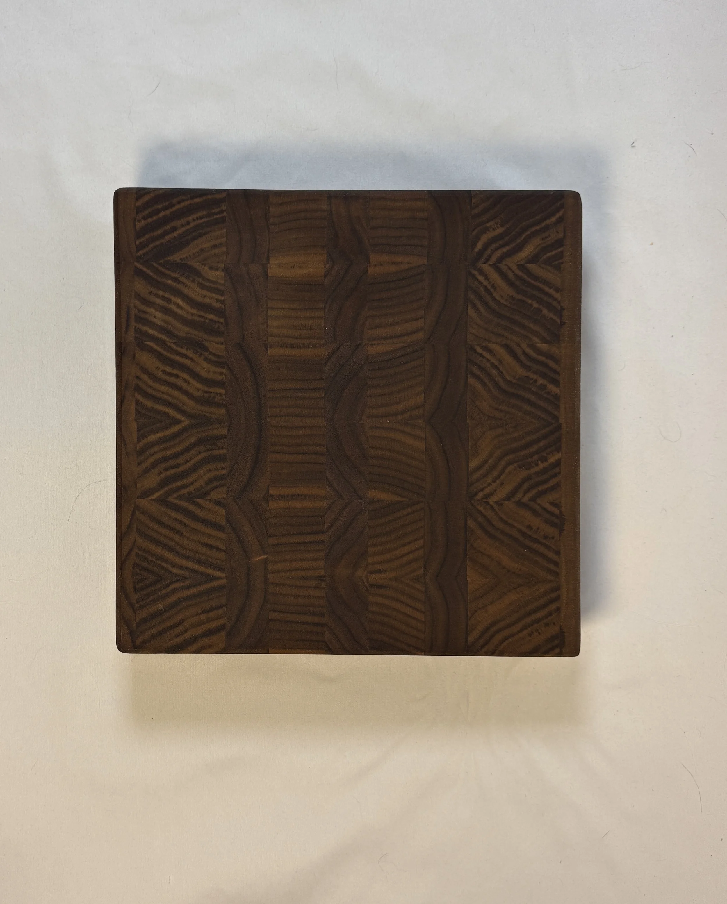 10.5" x 10.5" butcher block. 
